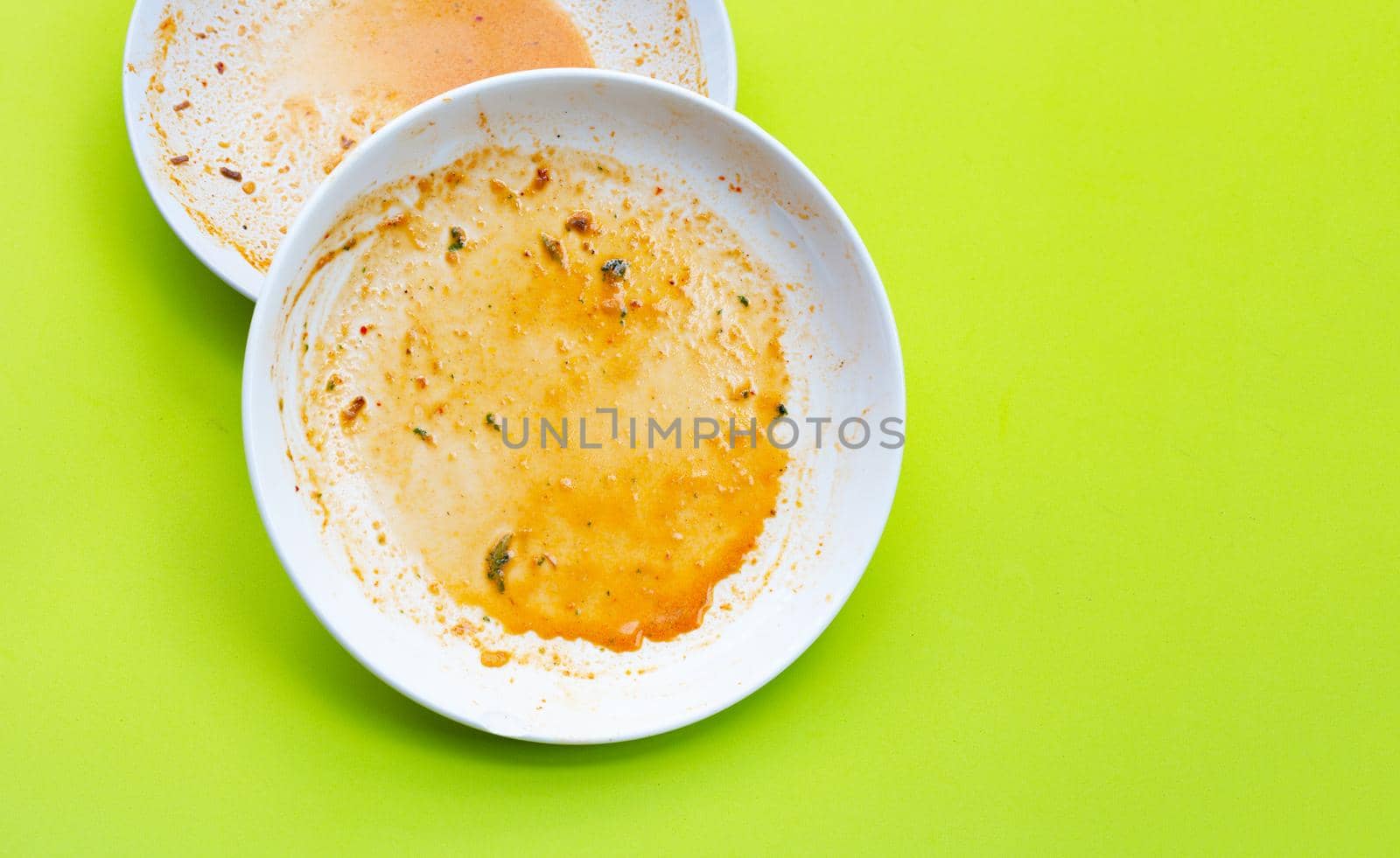 Dirty dishes on green background. Top view