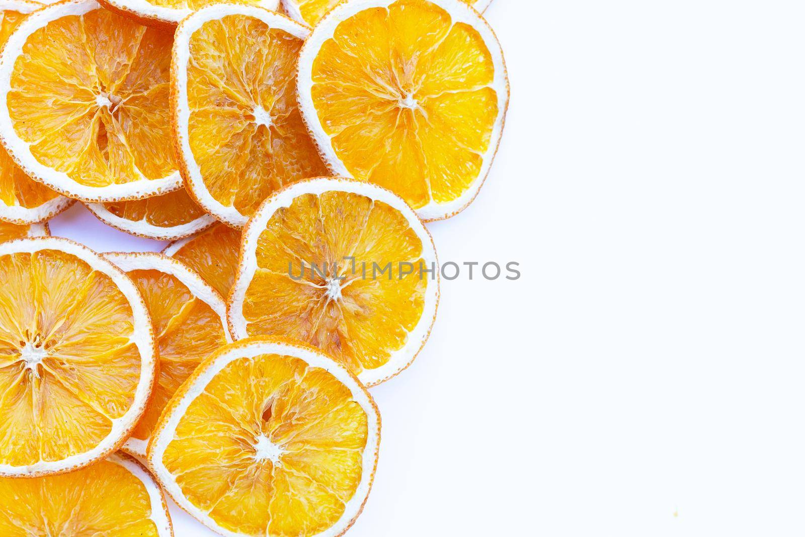 Dried orange slices on white background. by Bowonpat