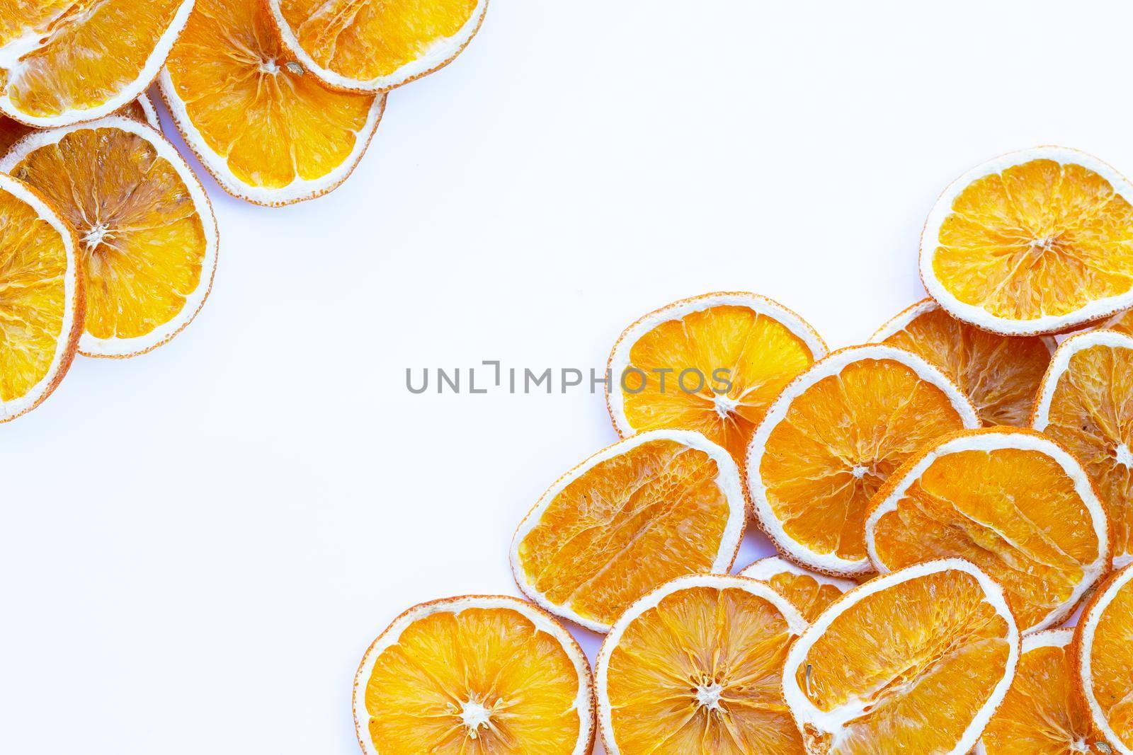 Dried orange slices on white background.