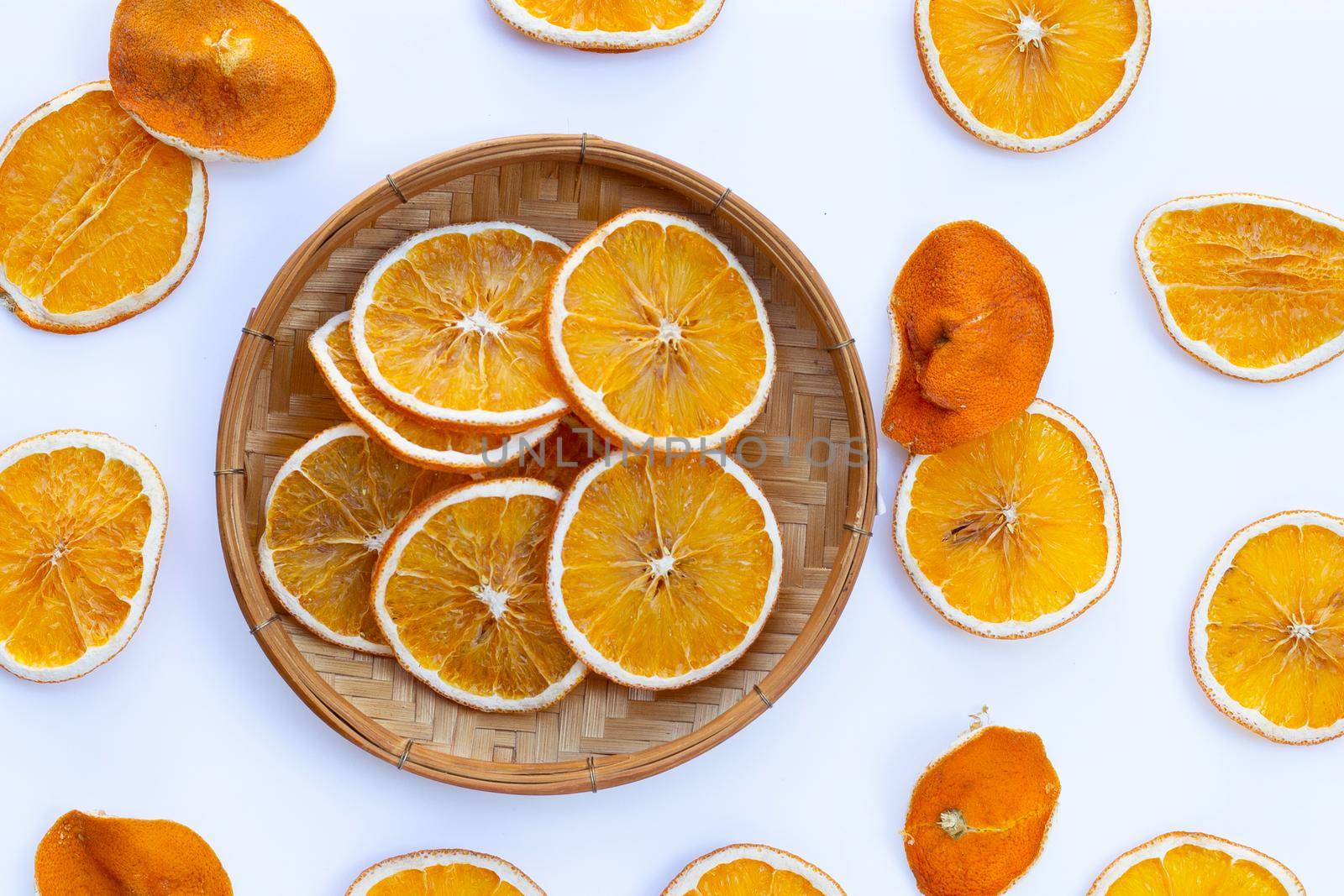 Dried orange slices on white background. by Bowonpat
