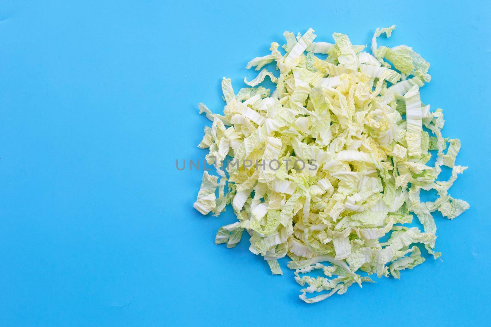 Chinese cabbage sliced on blue background