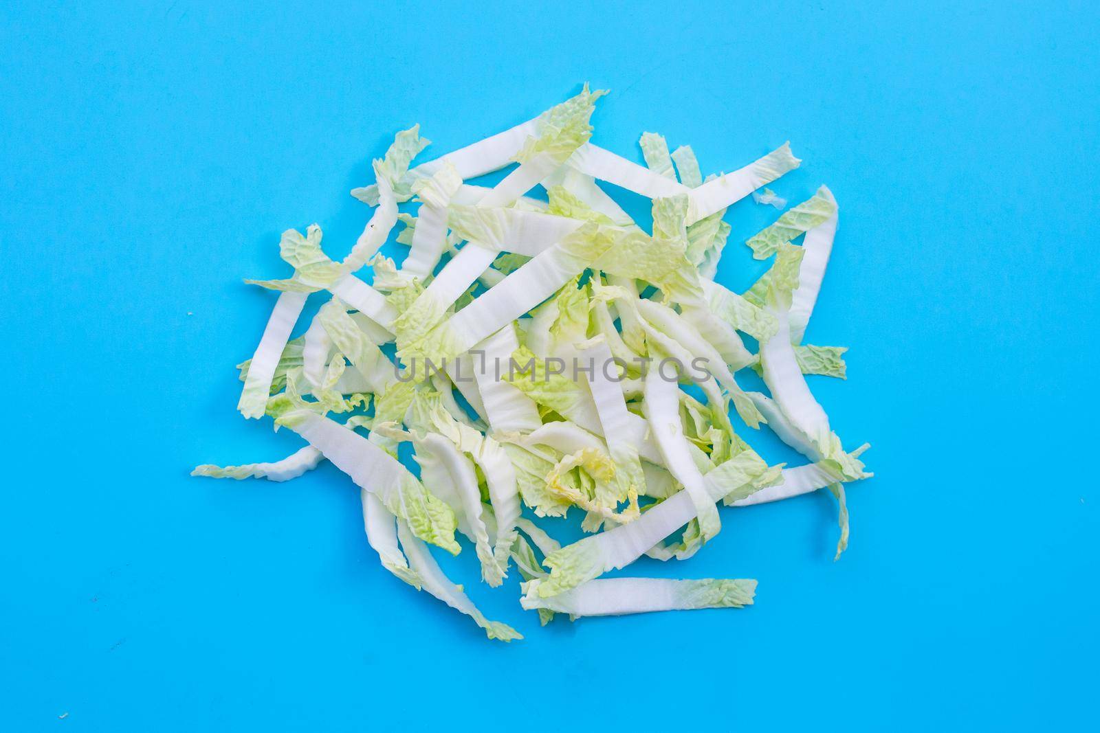 Chinese cabbage sliced on blue background