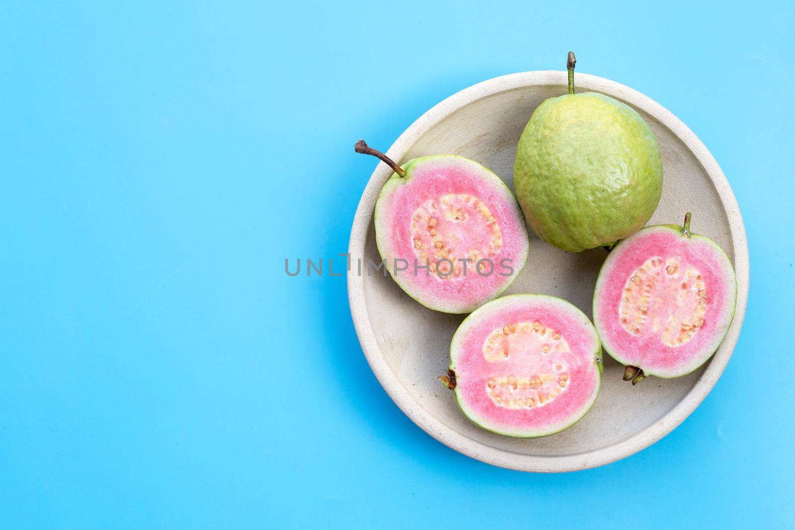 Pink guava on white background.