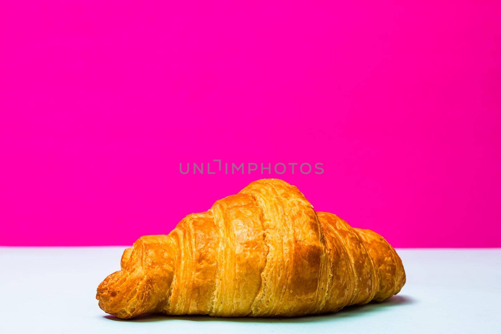 Detail of fresh croissant isolated, french breakfast concept.