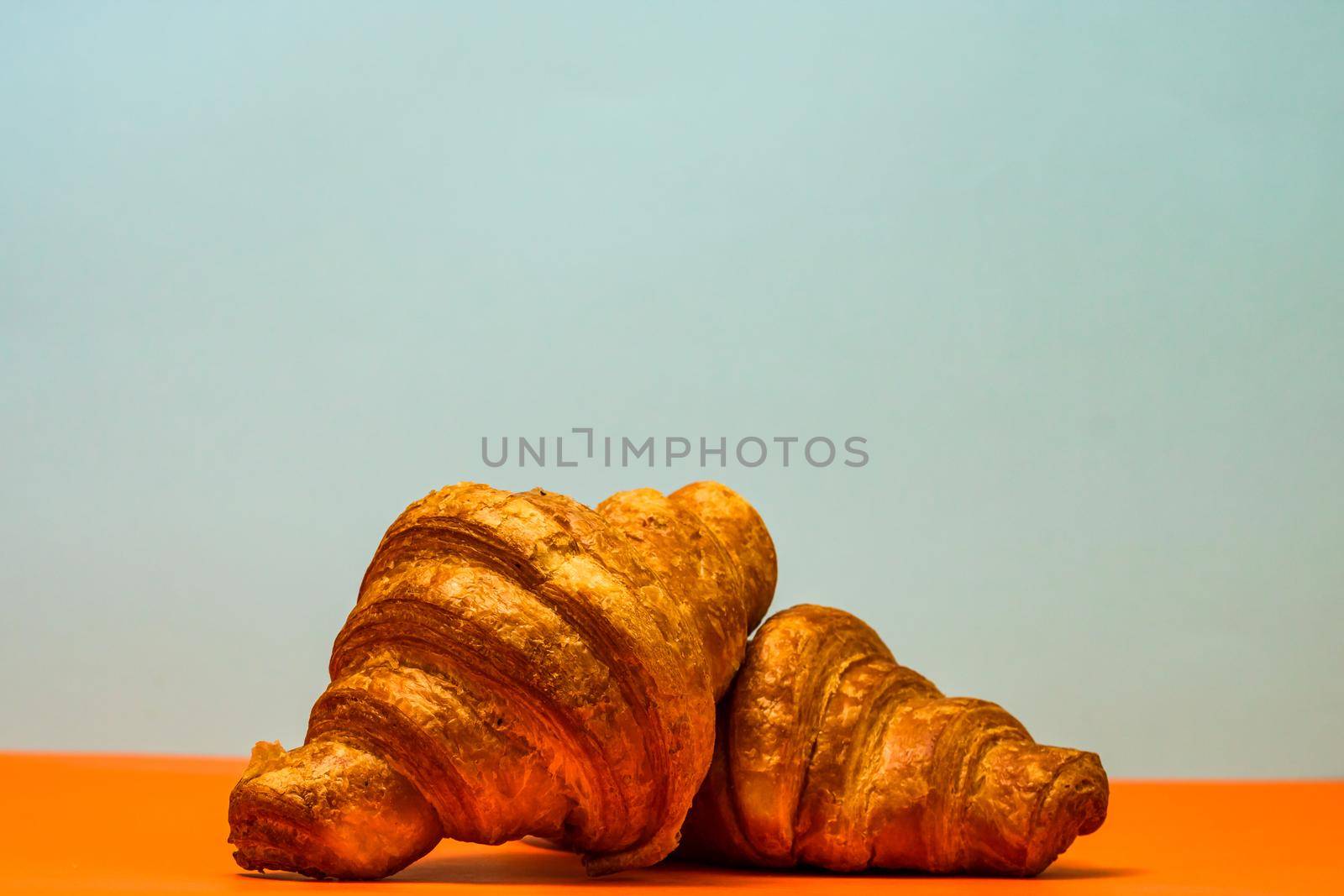 Fresh and delicious croissants isolated. French breakfast concept.