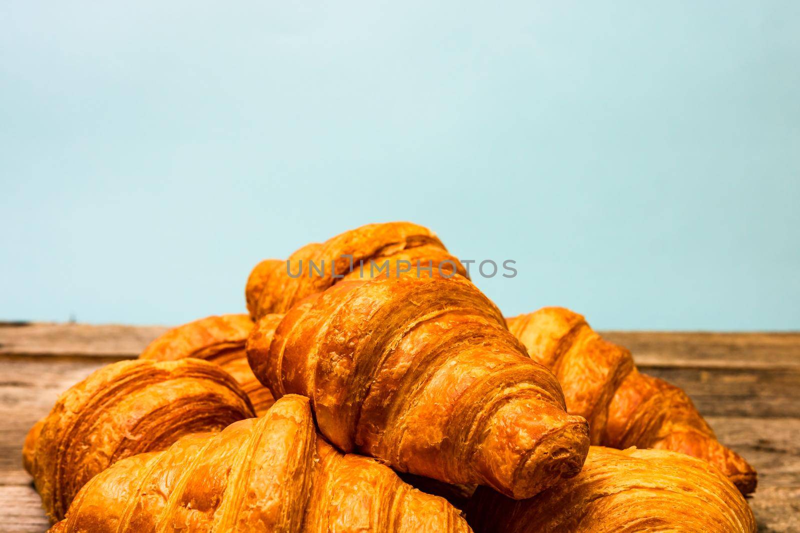 Fresh and delicious croissants isolated. French breakfast concept.