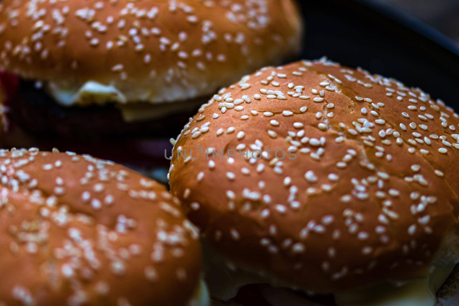 Closeup of fresh homemade tasty burgers on wooden table