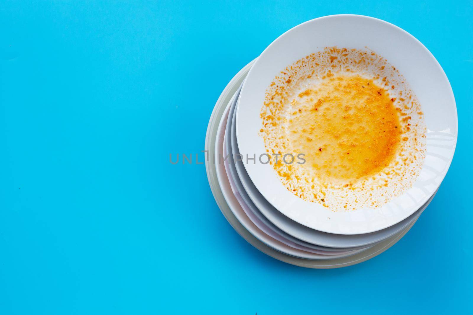 Dirty dishes on blue  background. Top view