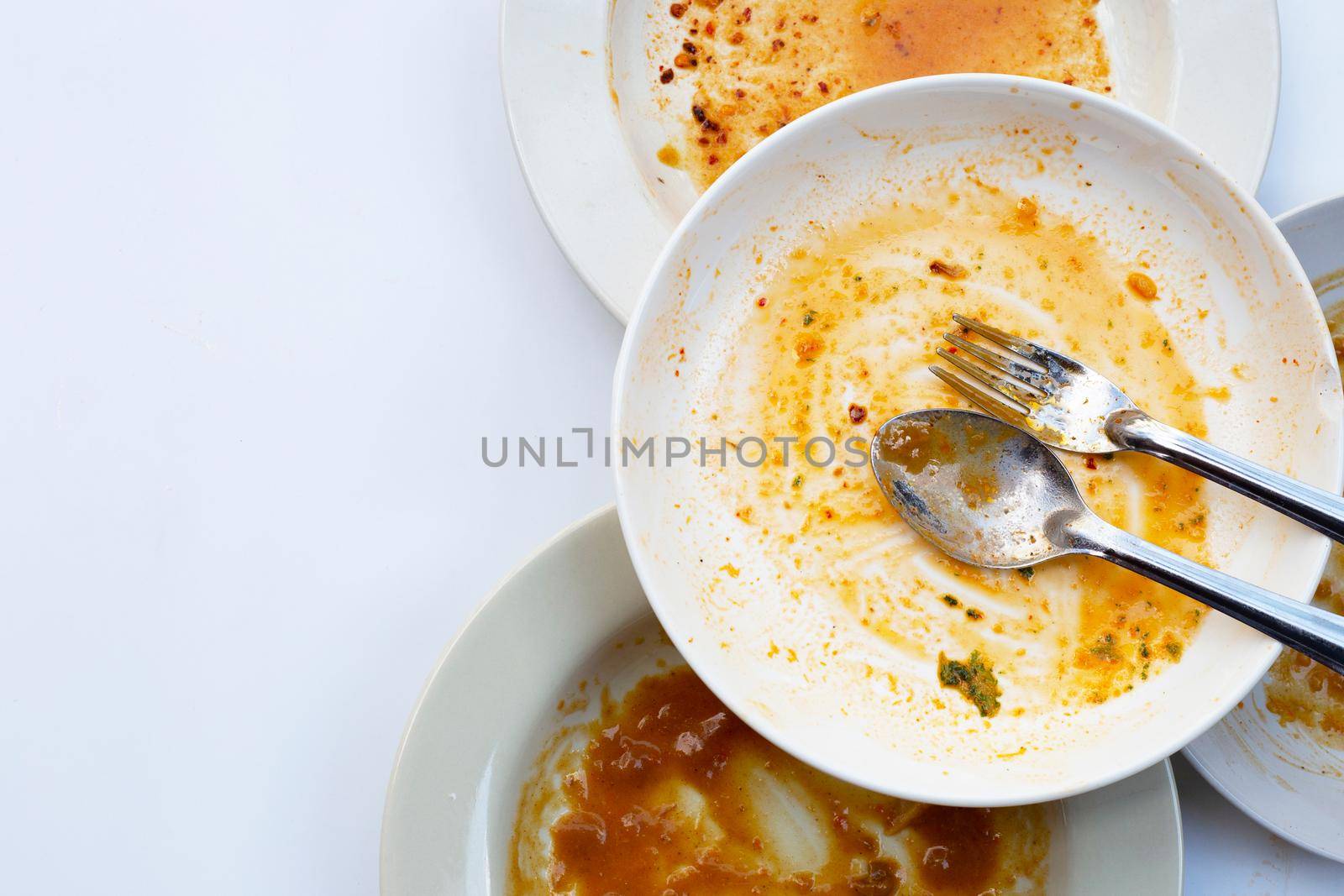 Dirty dishes on white background. Top view by Bowonpat