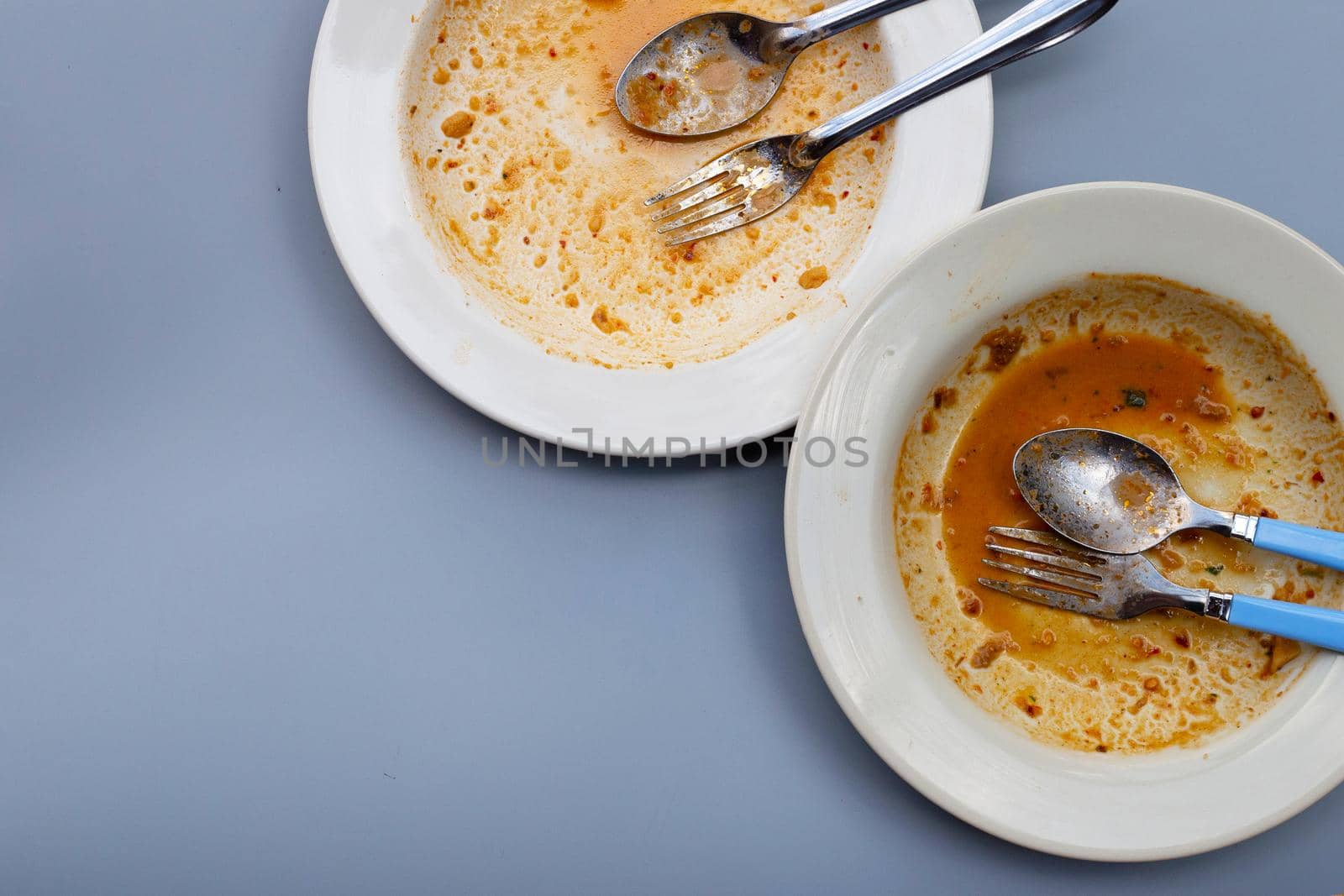Dirty dishes on grey background. Top view