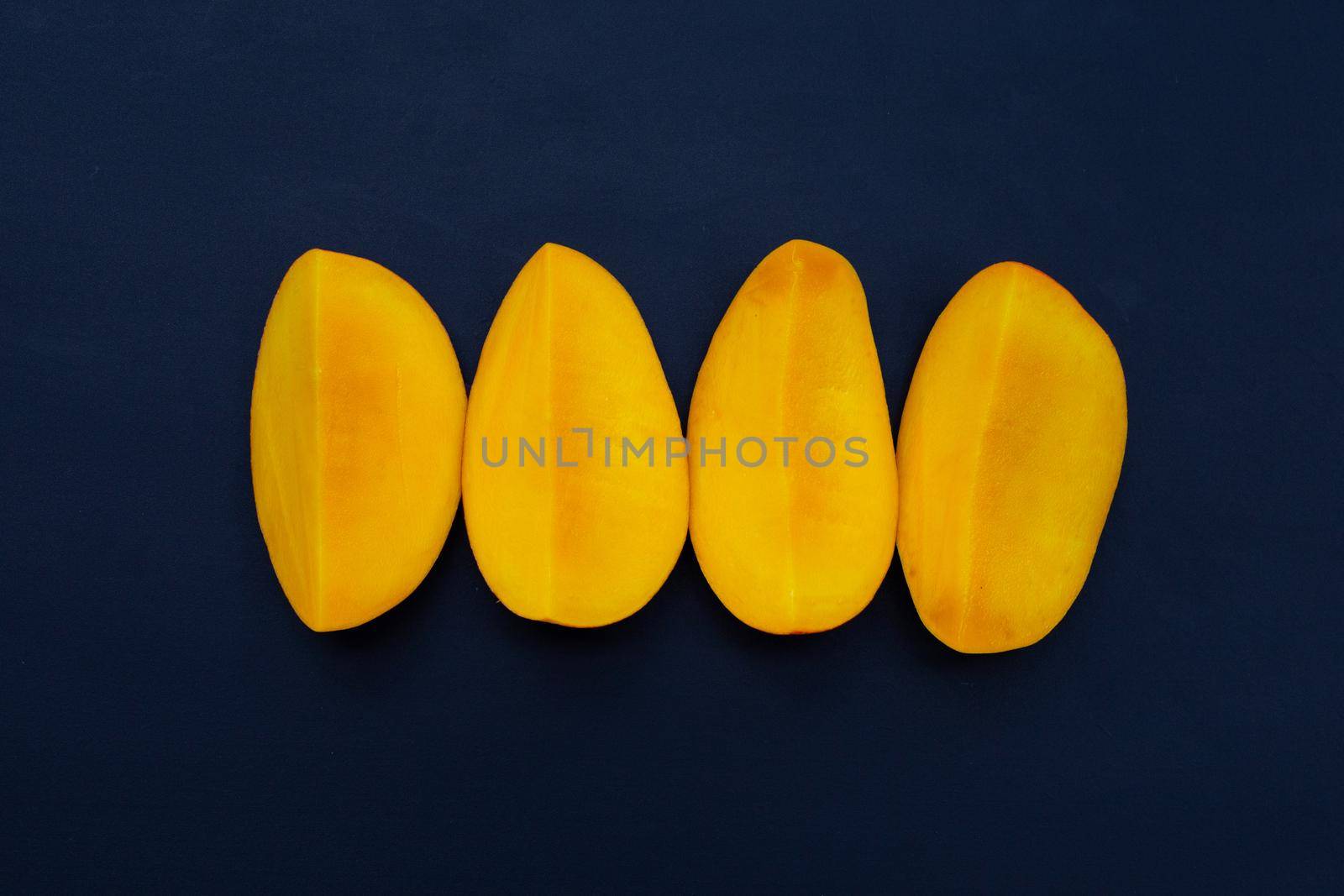 Tropical fruit, Mango  on dark background.