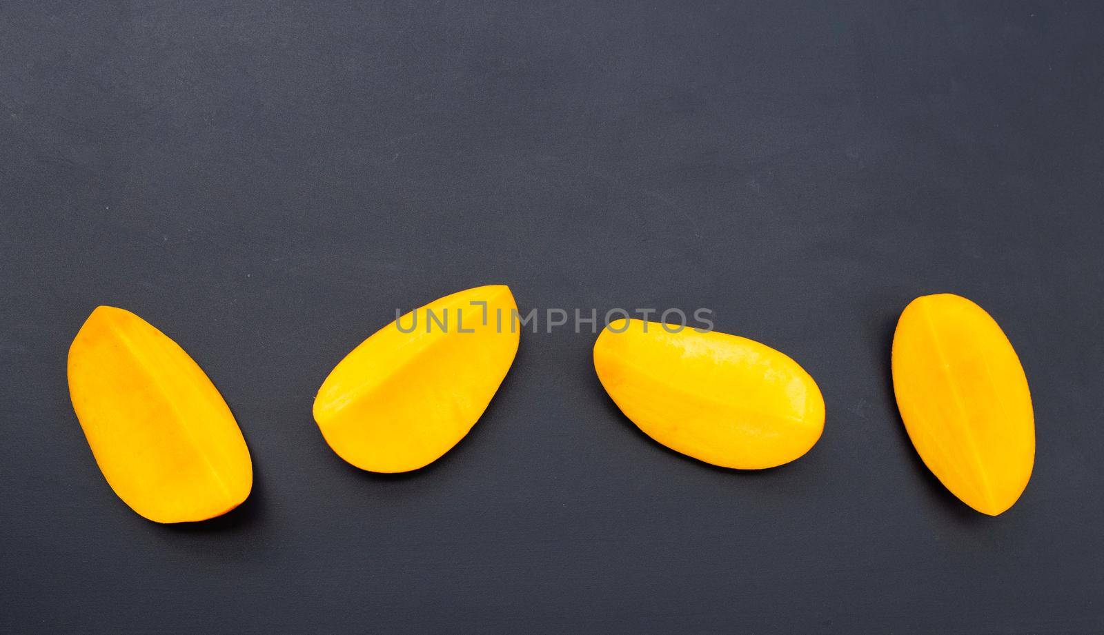 Tropical fruit, Mango  on dark background.