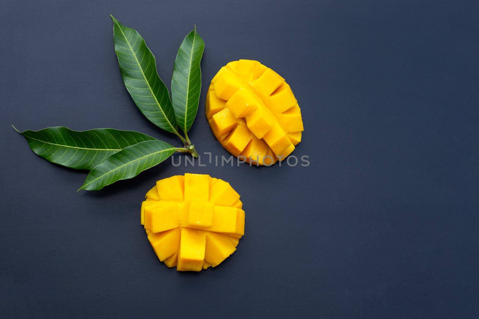 Tropical fruit, Mango on dark background.