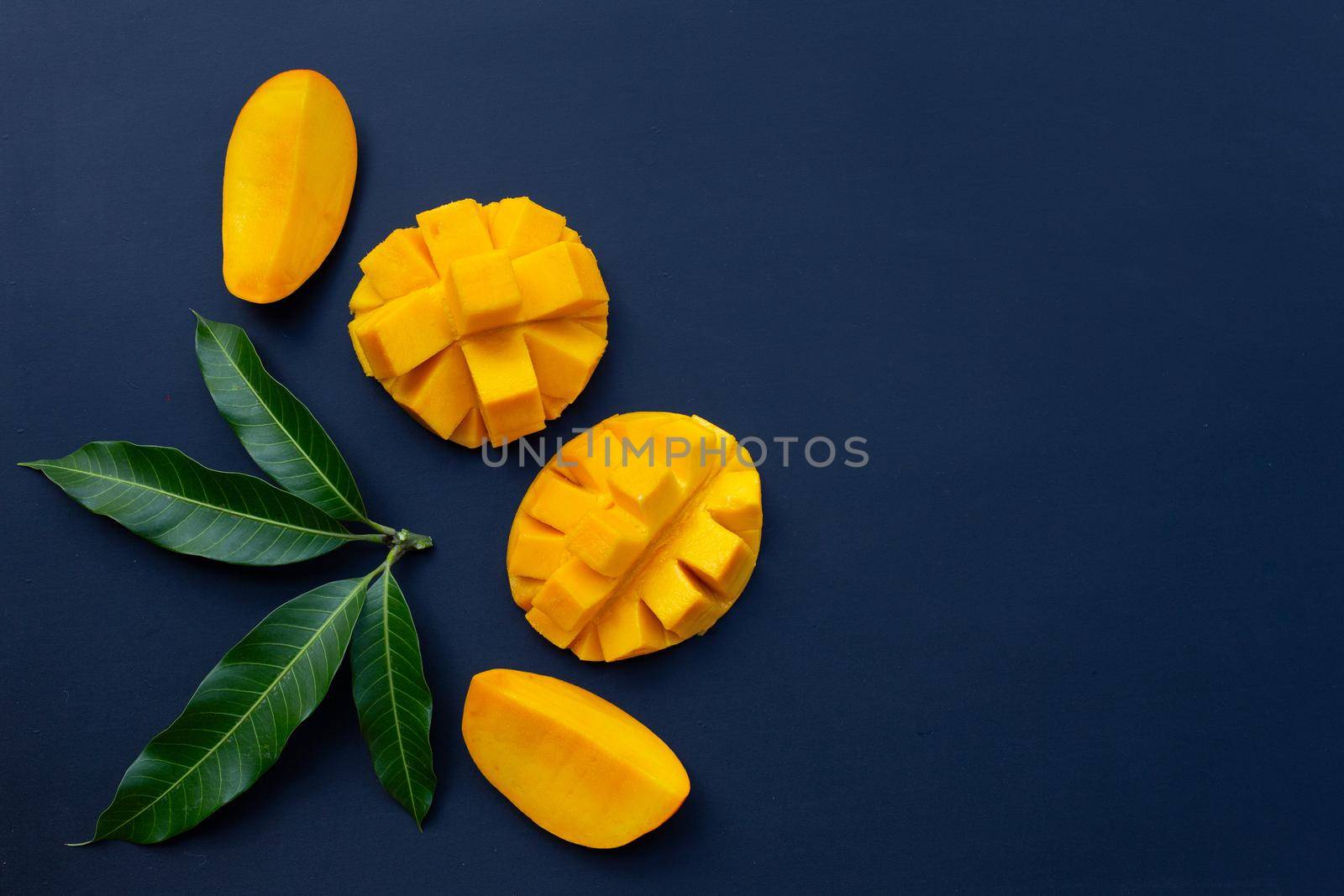 Tropical fruit, Mango  on dark background. by Bowonpat