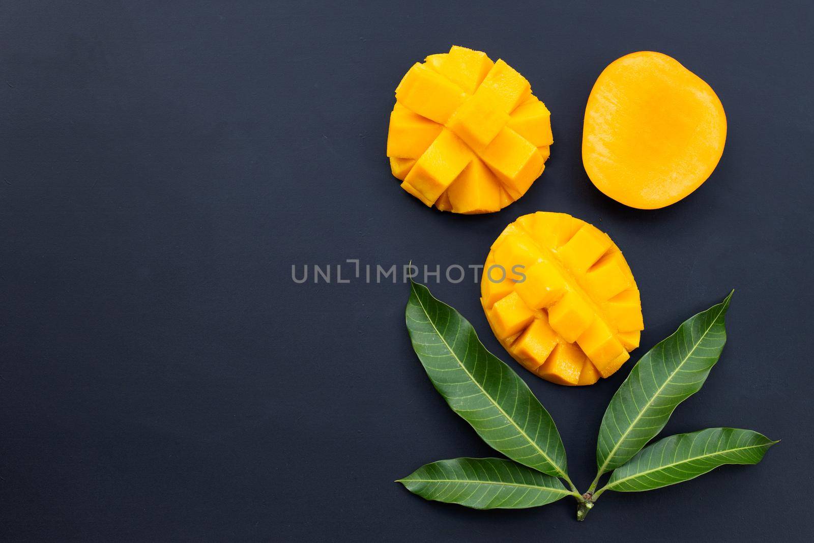 Tropical fruit, Mango  on dark background.