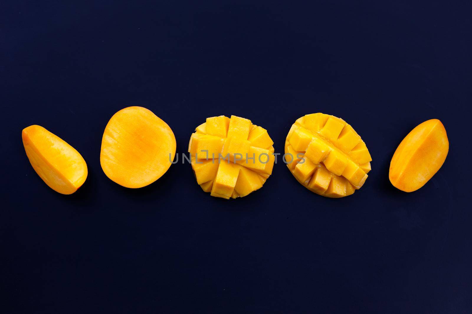 Tropical fruit, Mango  on dark background.