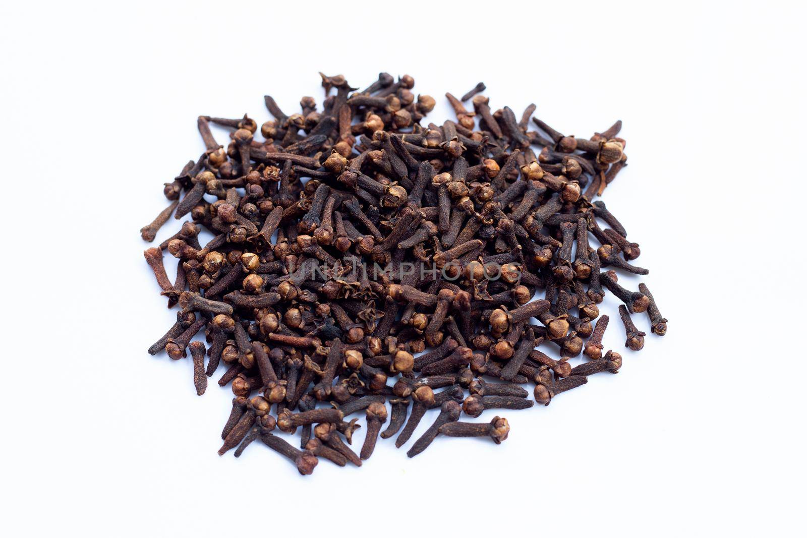 Spice dried cloves on white background.