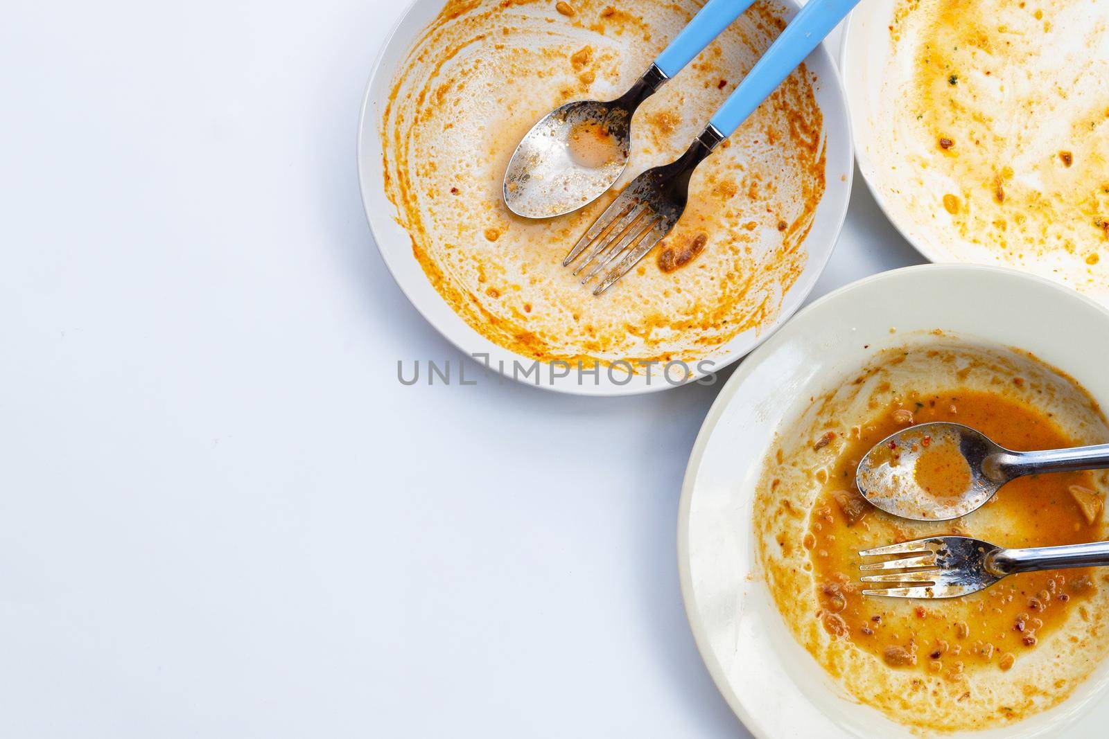 Dirty dishes on white background. Top view by Bowonpat