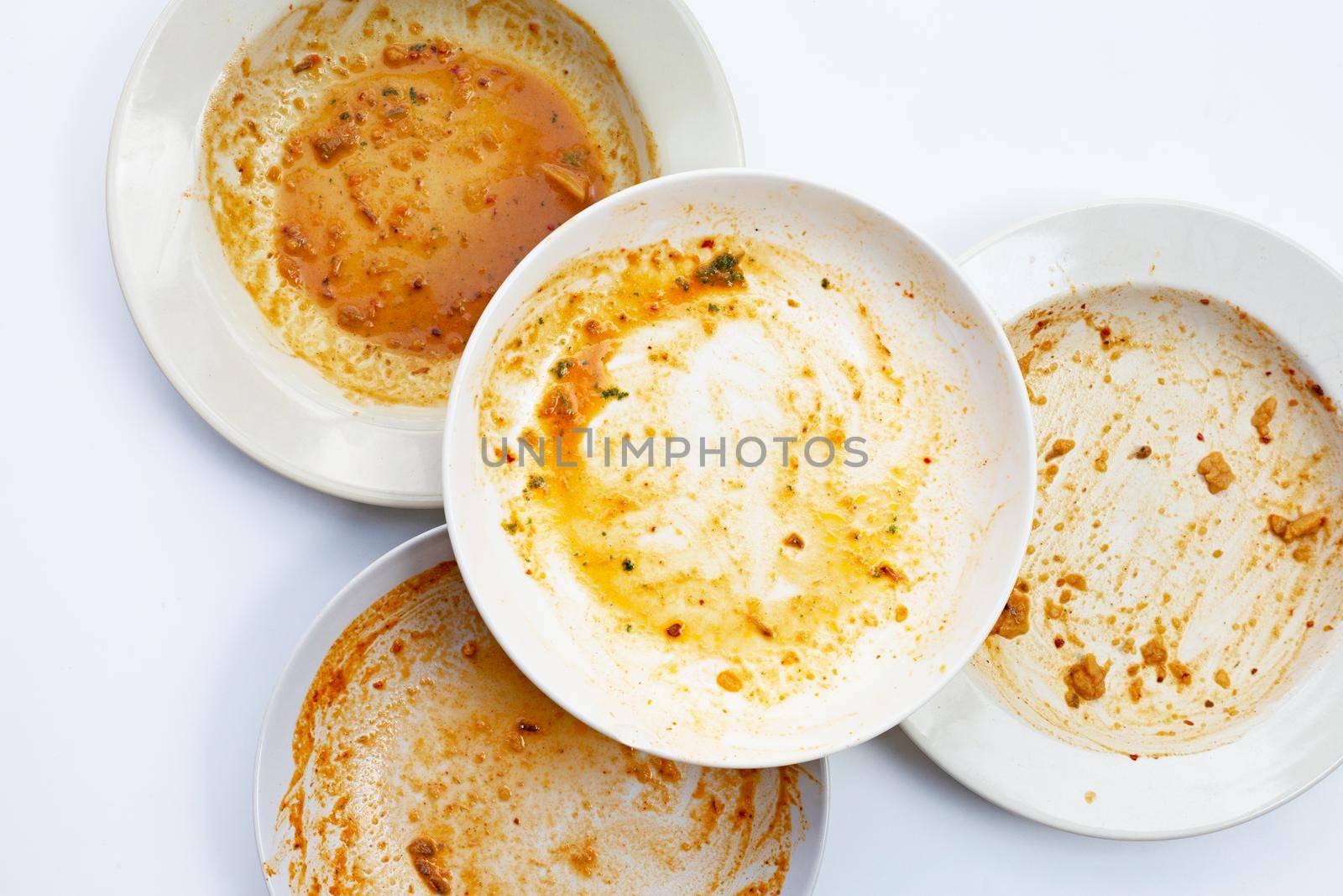 Dirty dishes on white background. Top view by Bowonpat