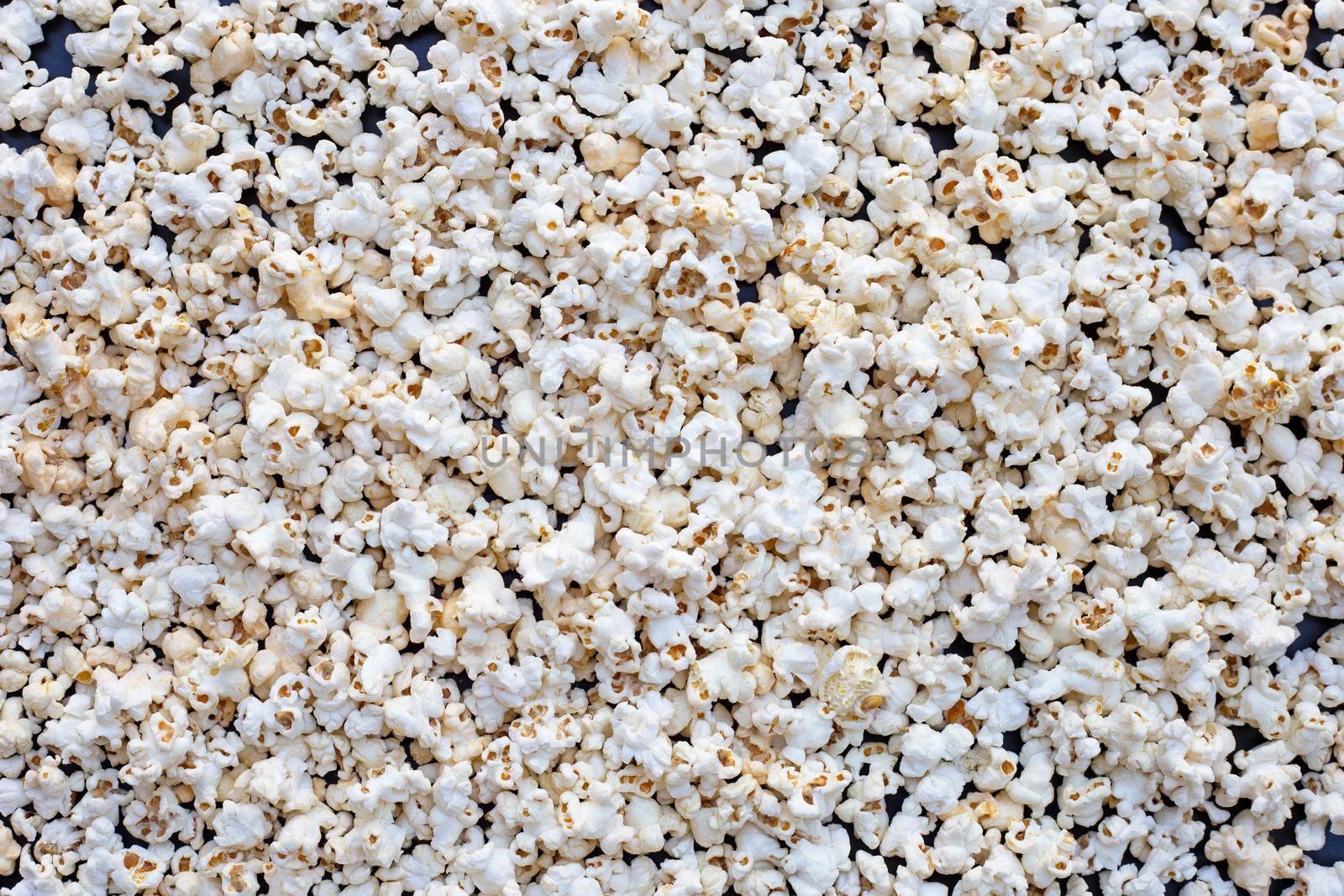 Popcorn on dark background. Copy space