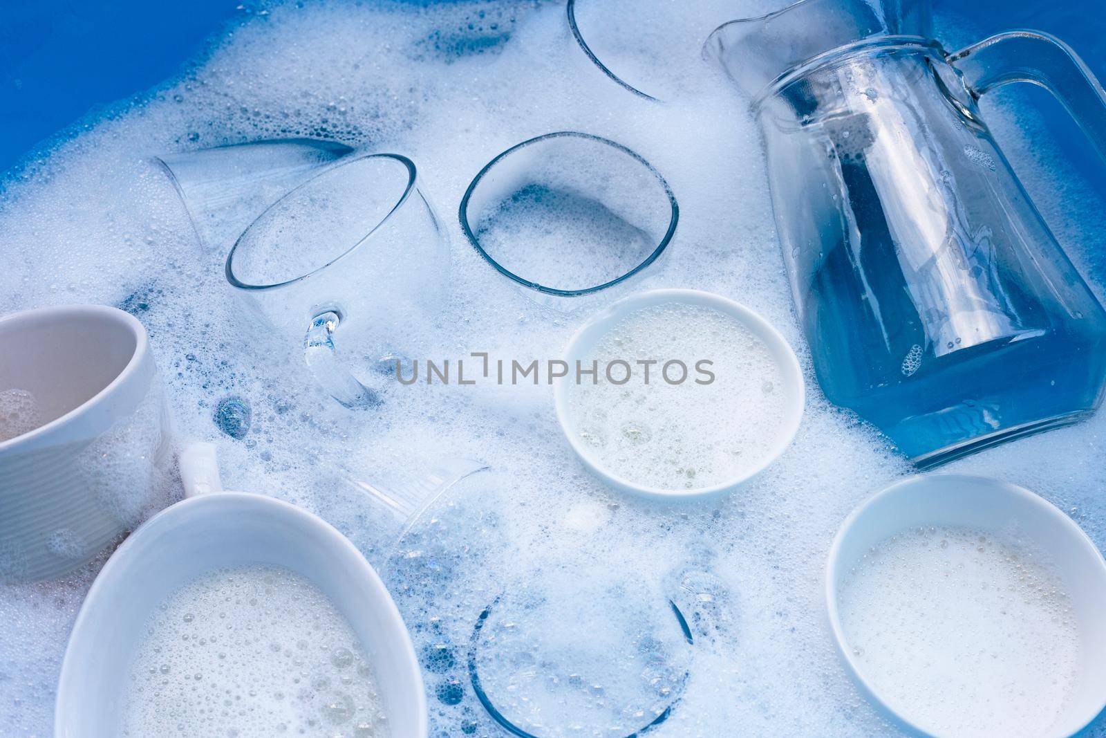 Washing used drinking glasses and cups by Bowonpat