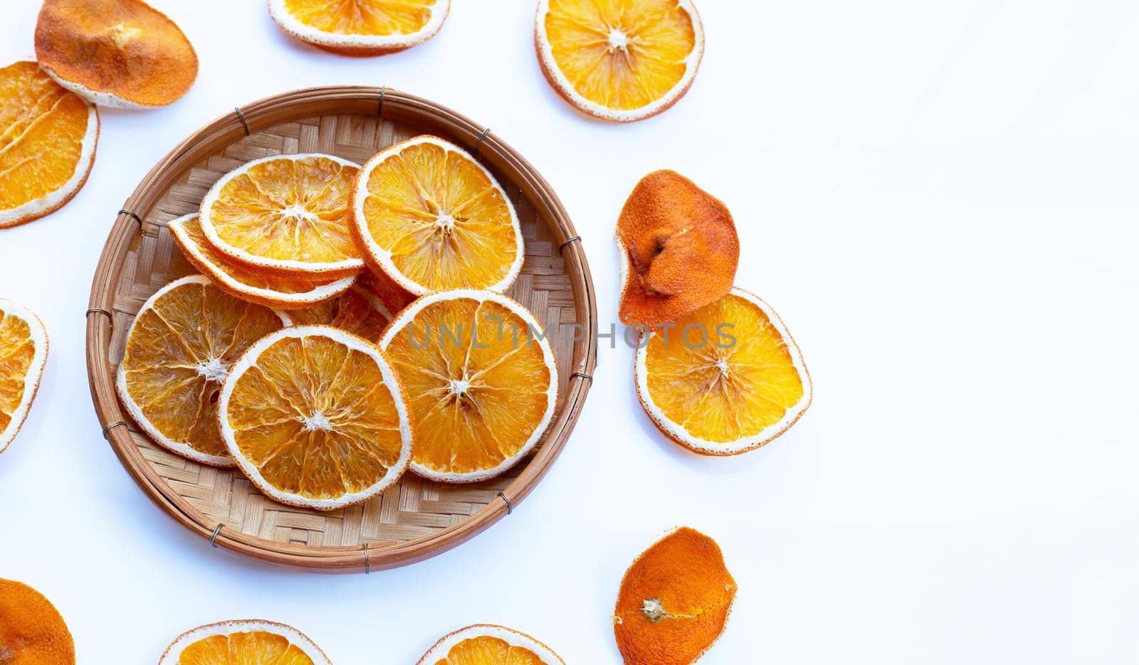 Dried orange slices on white background.