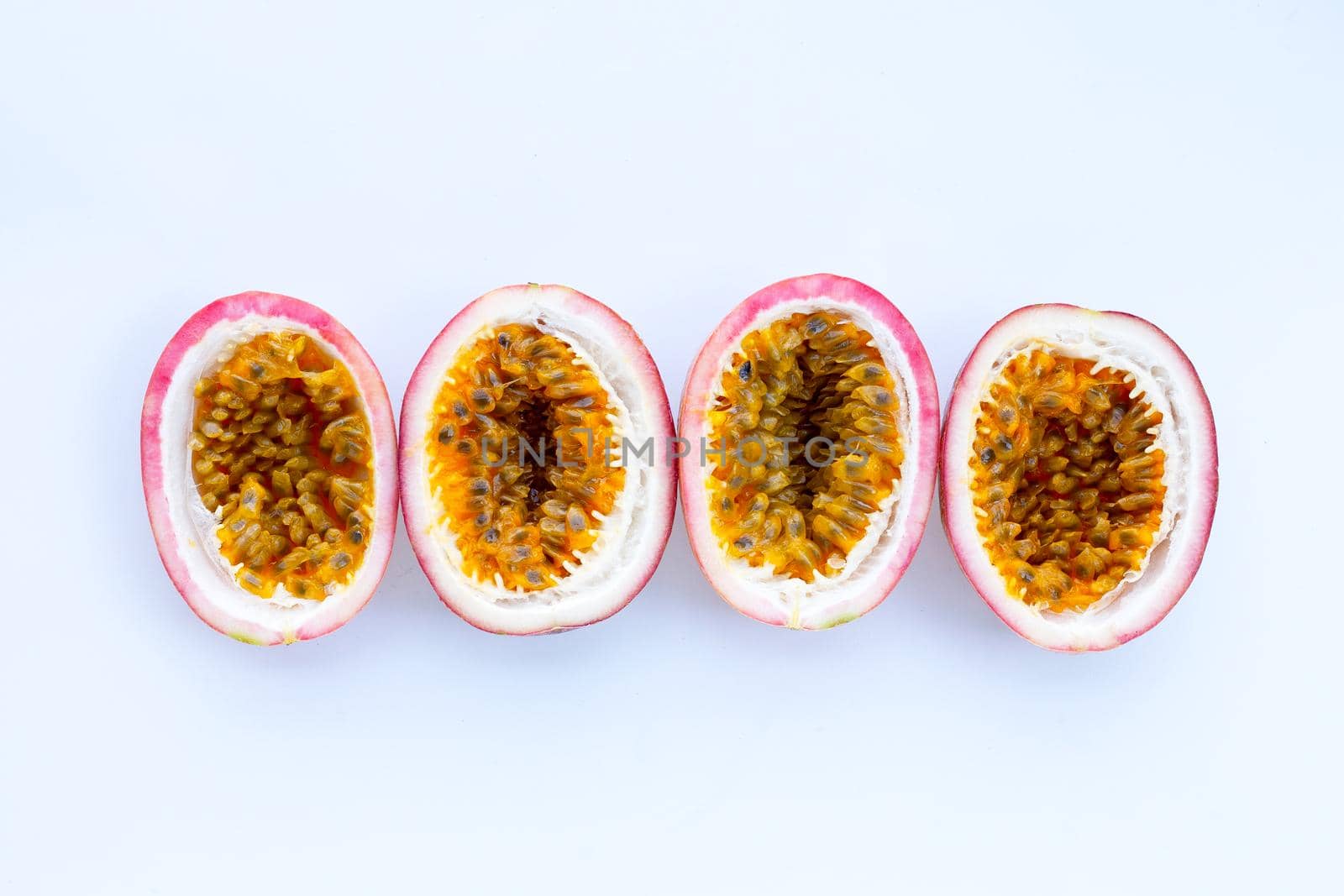 Passion fruit on white background. Top view by Bowonpat