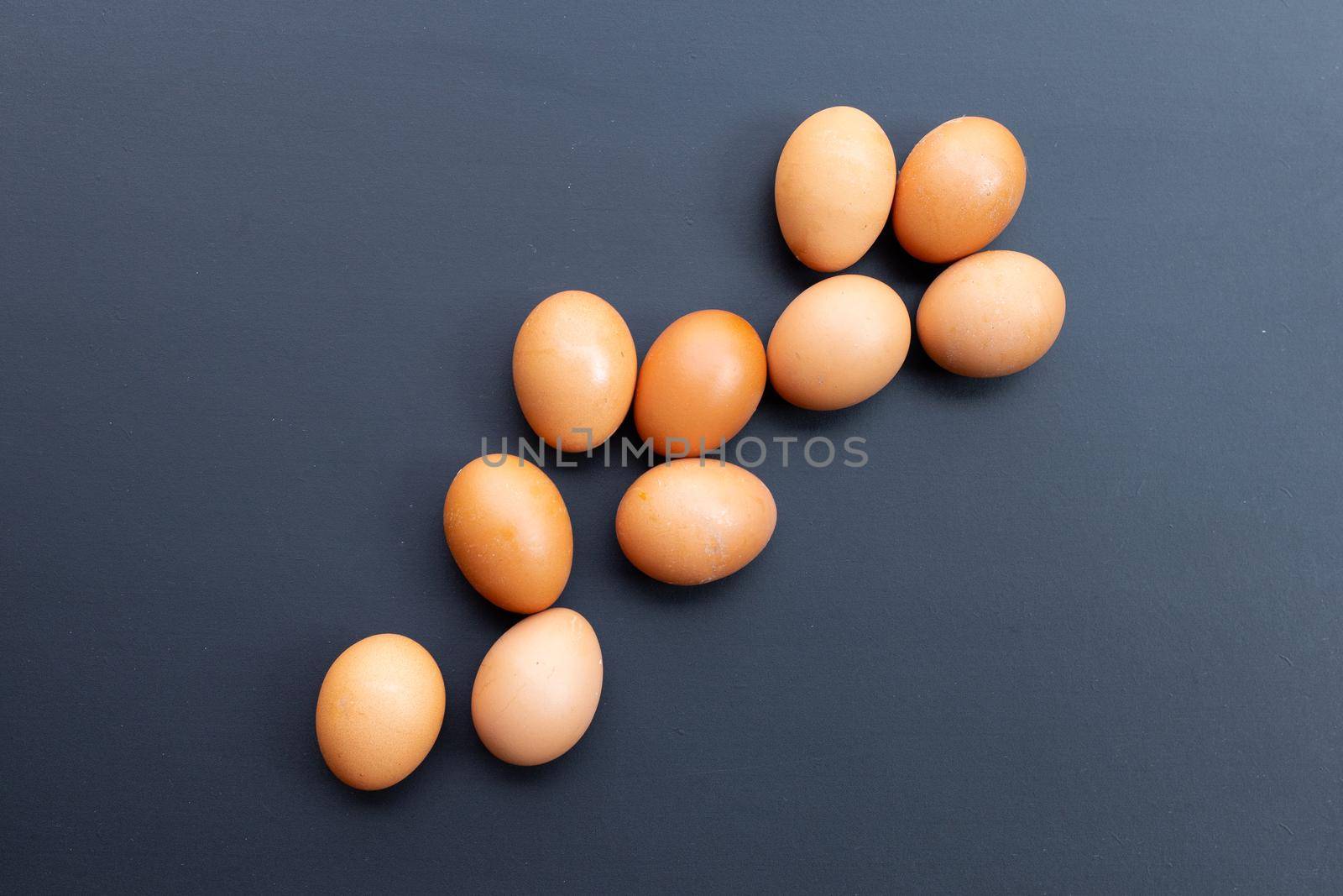 Eggs on dark background. Copy space by Bowonpat