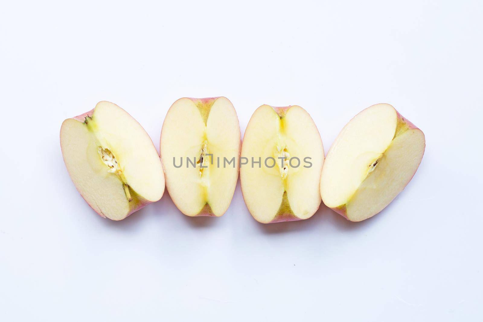 Ripe apple slices on white background. by Bowonpat