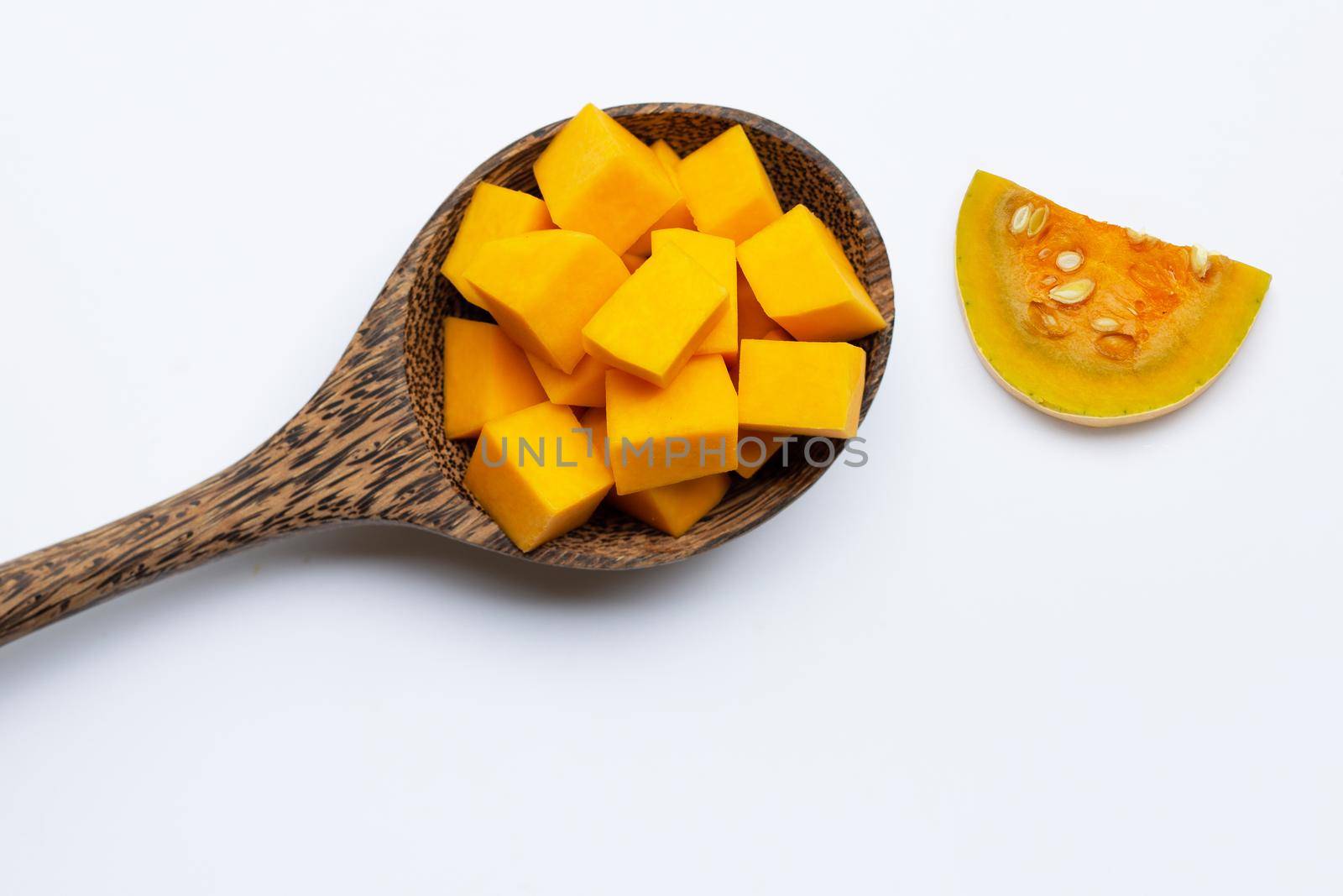 Cut and slices butternut squash on white background.