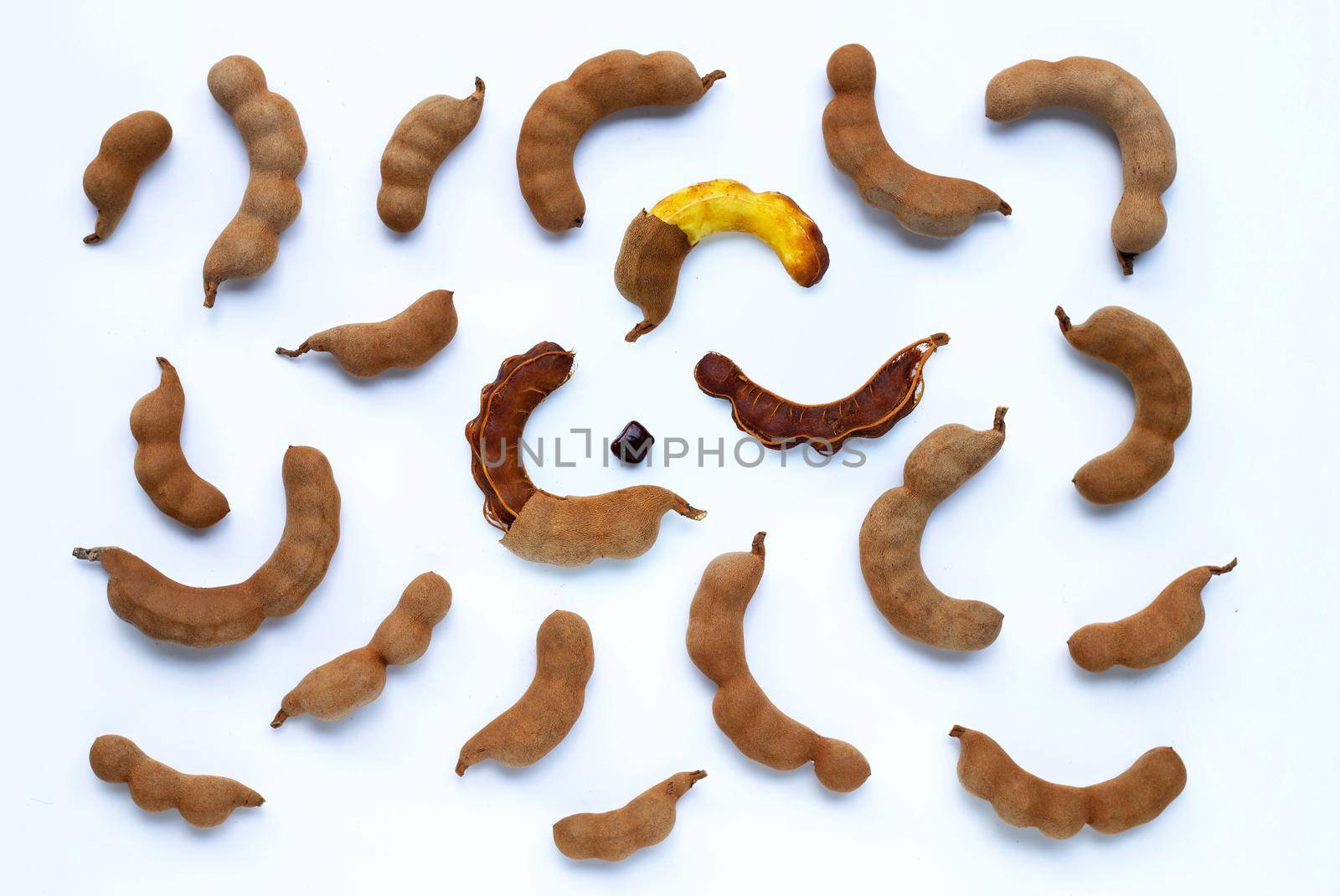 Tamarind tropical fruit on white background. Top view