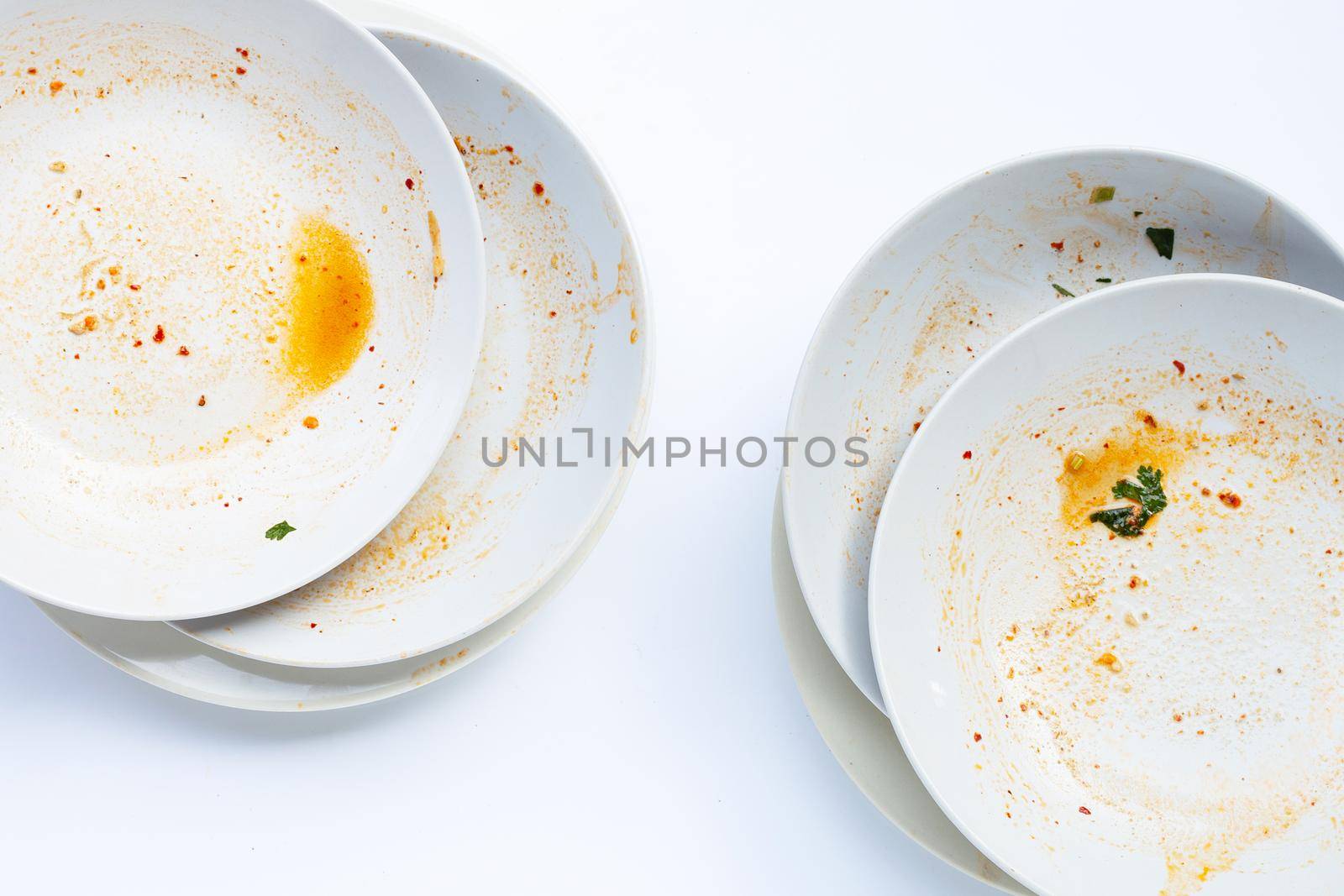 Dirty dishes on white background. by Bowonpat