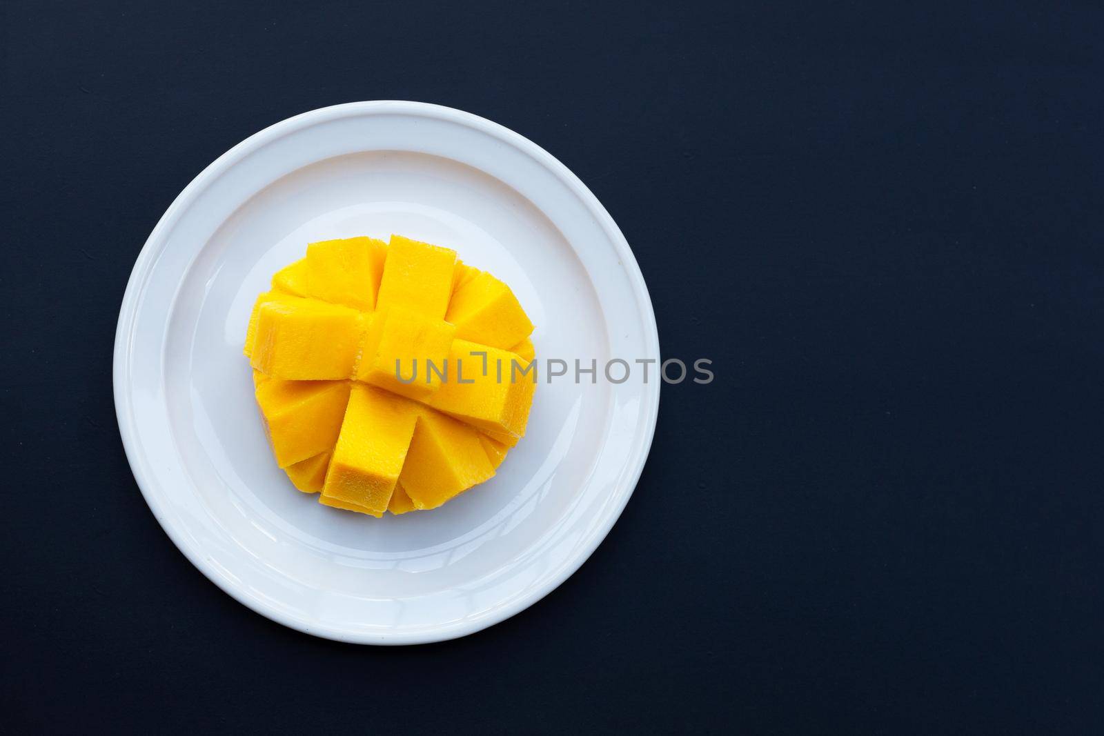 Tropical fruit, Mango  on dark background. by Bowonpat