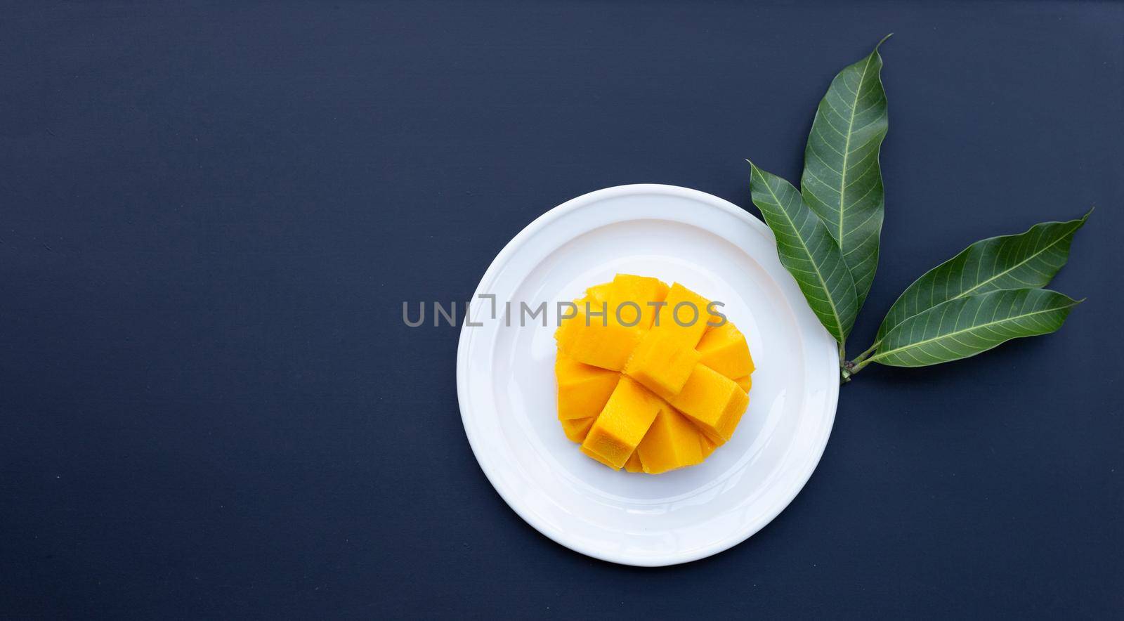 Tropical fruit, Mango  on dark background. by Bowonpat