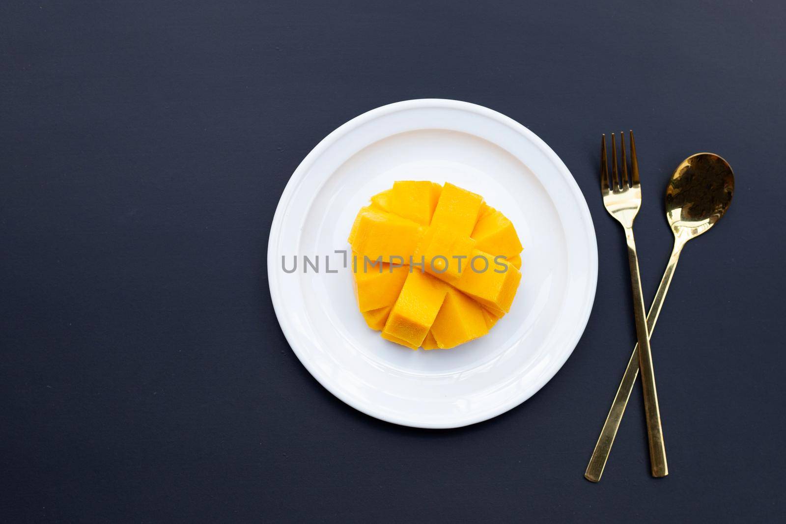 Tropical fruit, Mango  on dark background. by Bowonpat