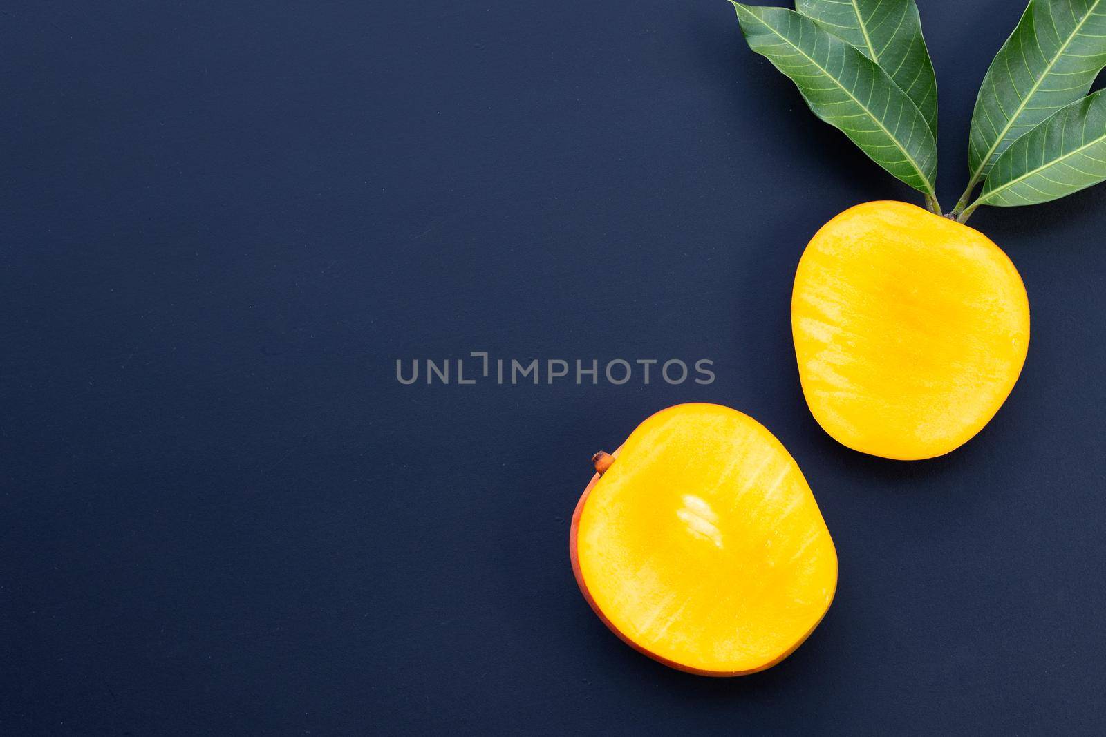 Tropical fruit, Mango  on dark background. by Bowonpat