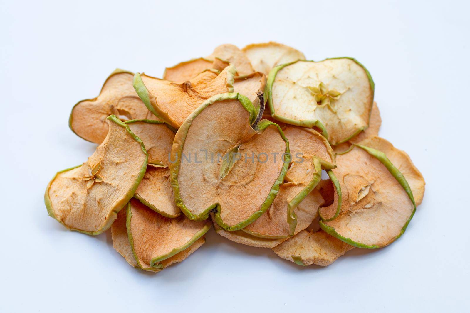 Dried apple slices on white background by Bowonpat