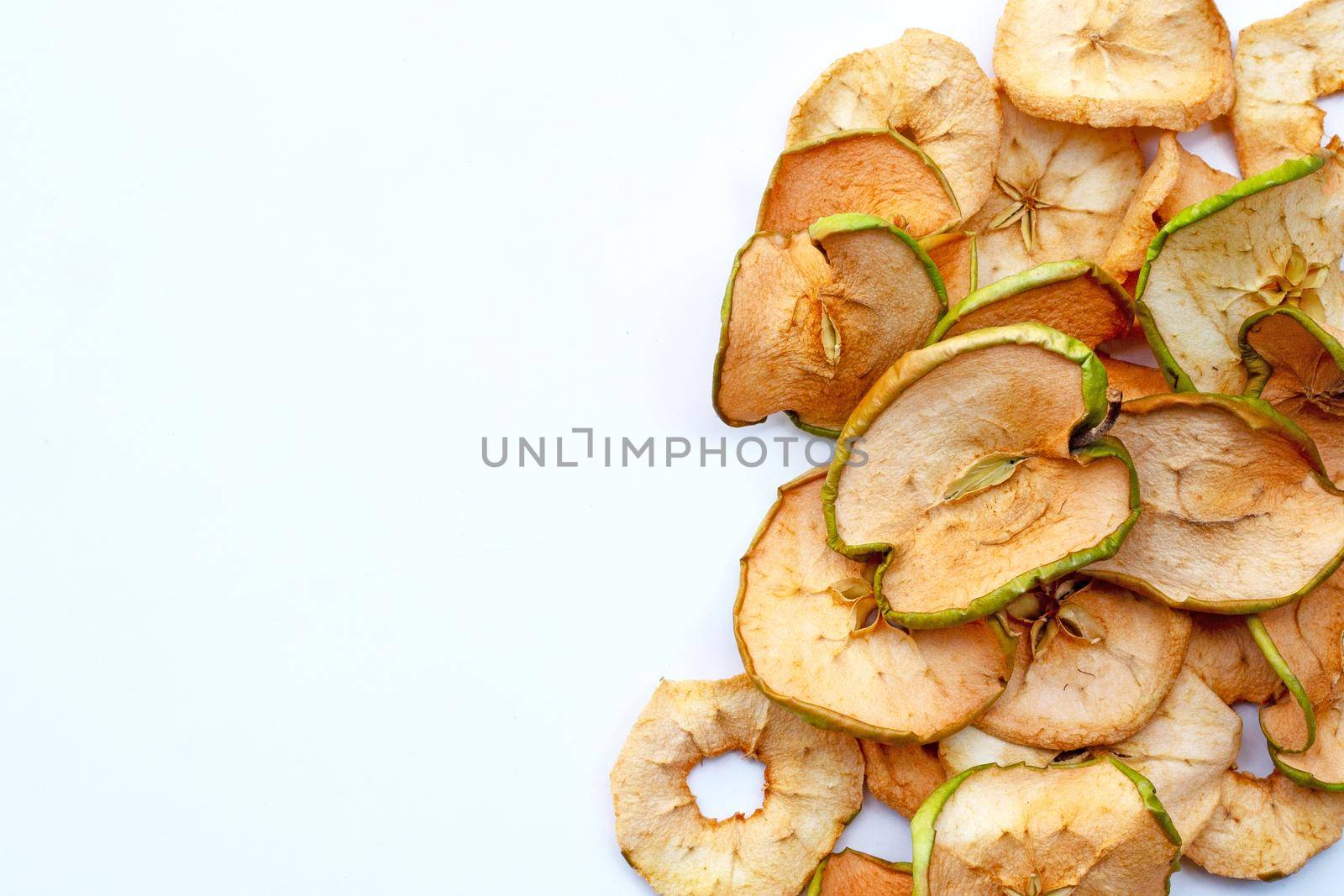 Dried apple slices on white background