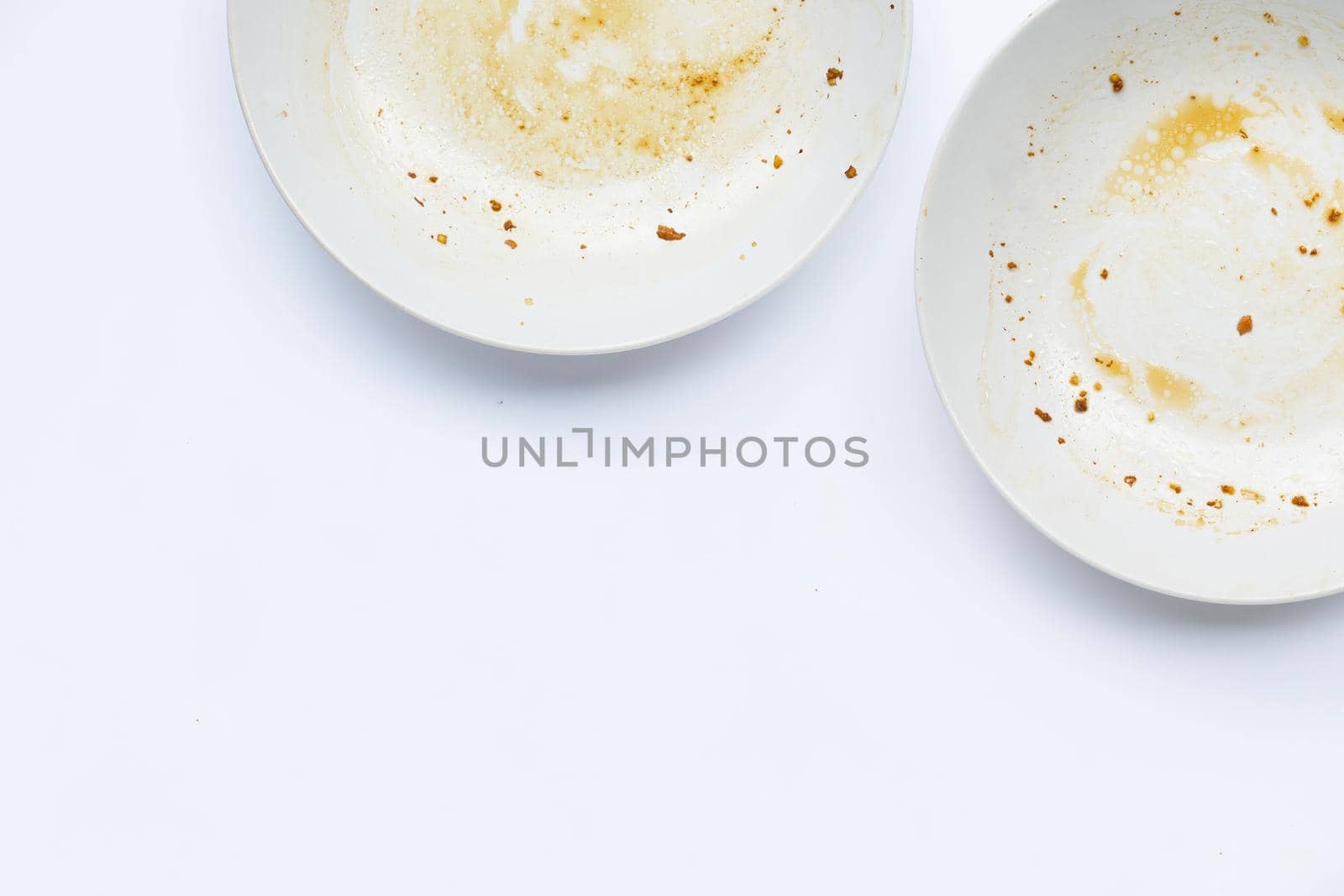 Dirty dishes on white background. by Bowonpat