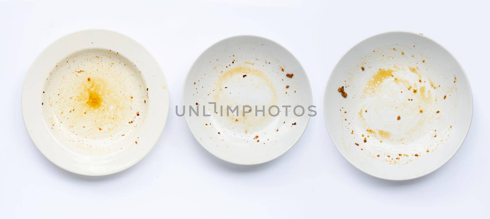 Dirty dishes on white background. by Bowonpat