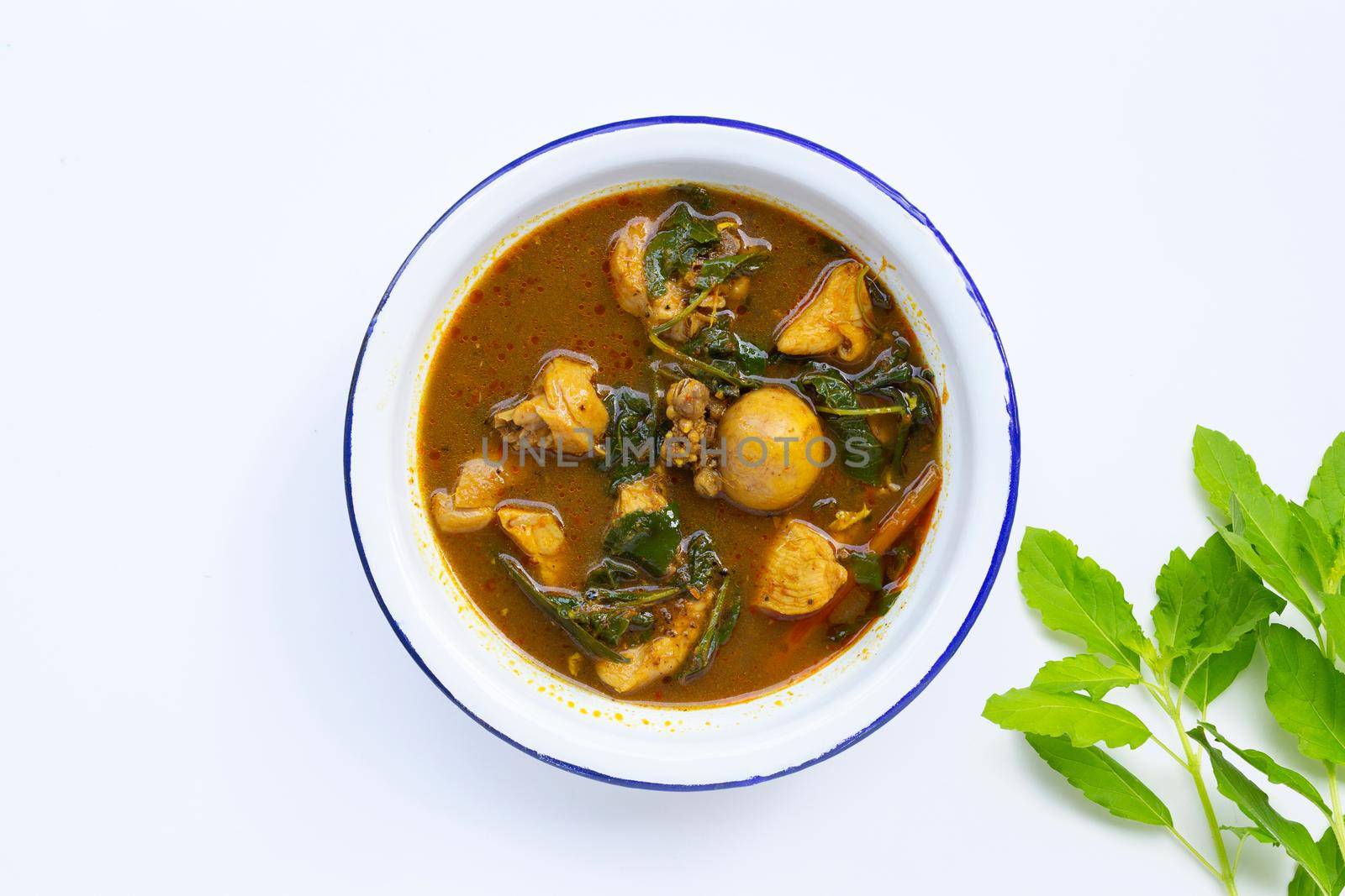 Spicy chicken curry with Thai Southern chili paste on white background. 