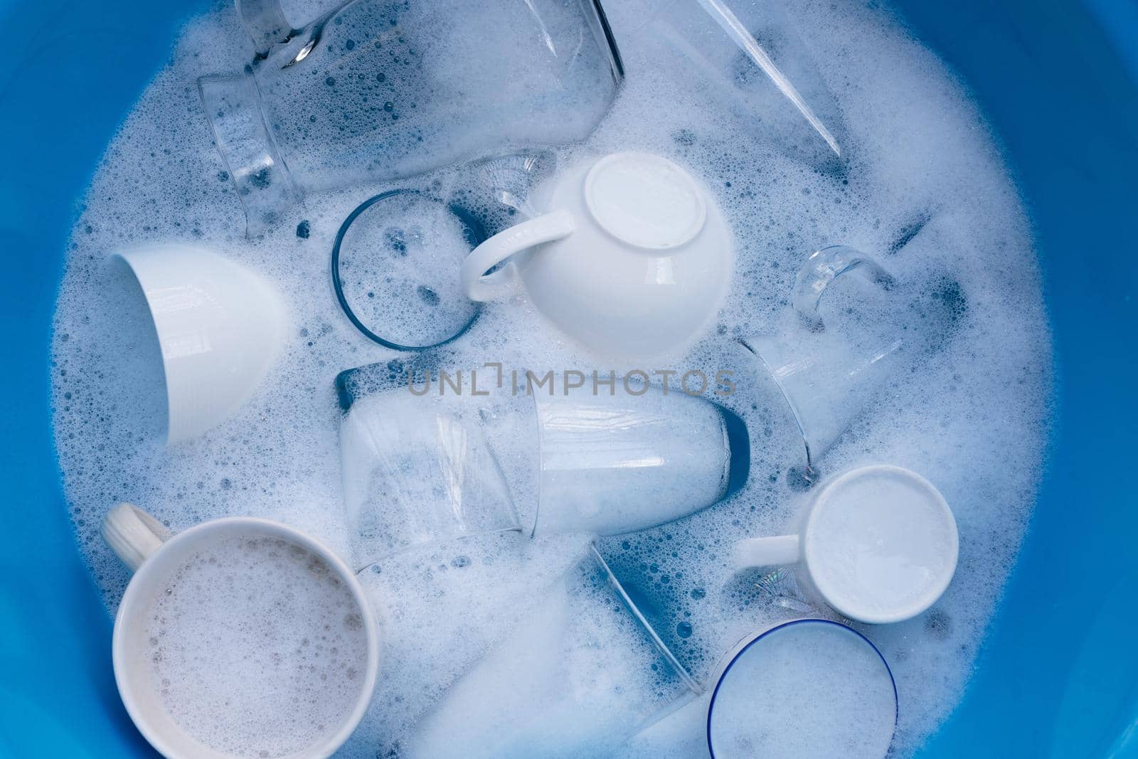 Washing drinking glasses and cups by Bowonpat