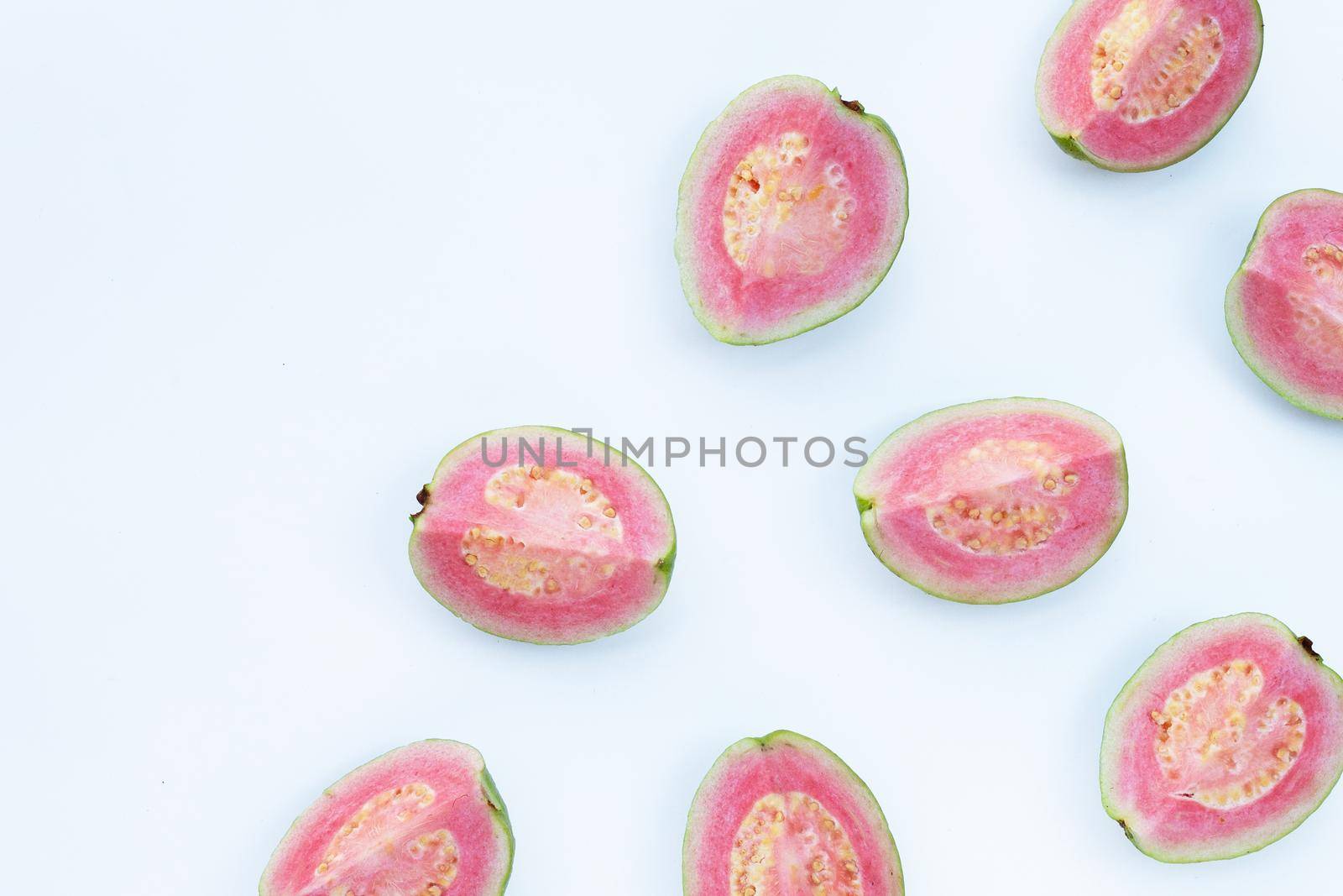 Pink guava on white background. by Bowonpat