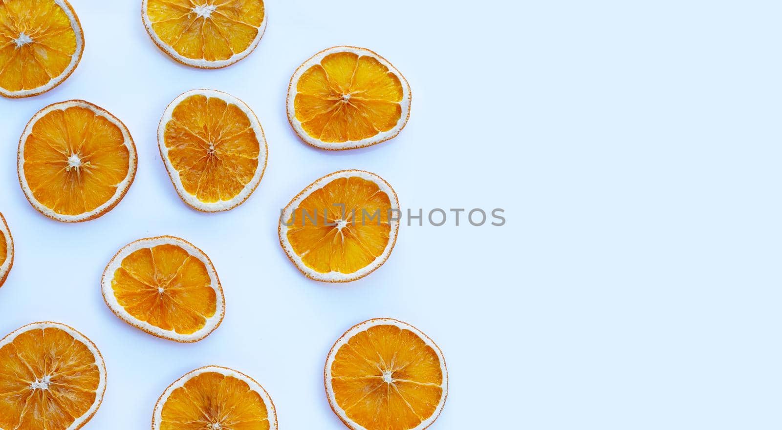 Dried orange slices on white background.