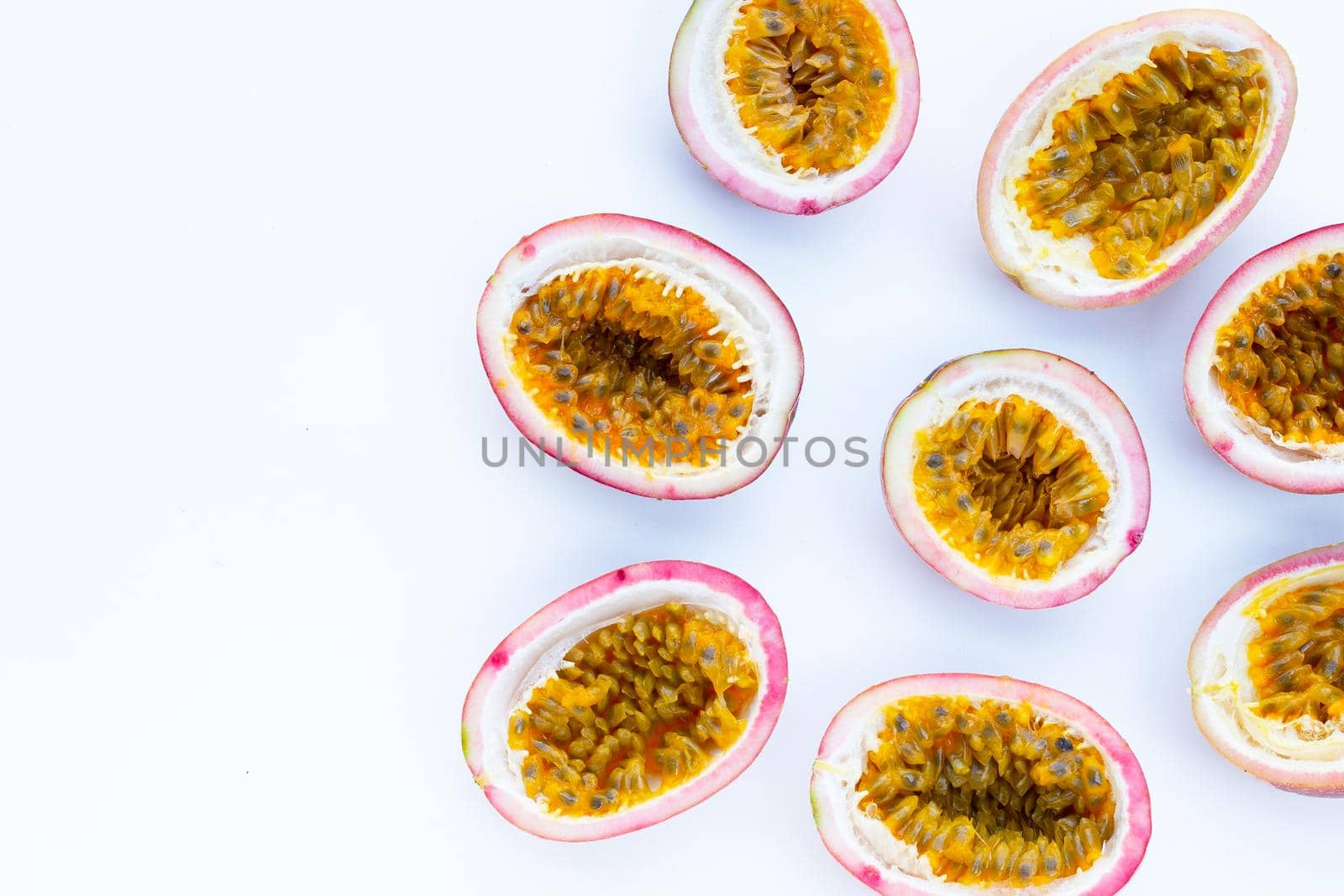 Passion fruit on white background. Top view by Bowonpat