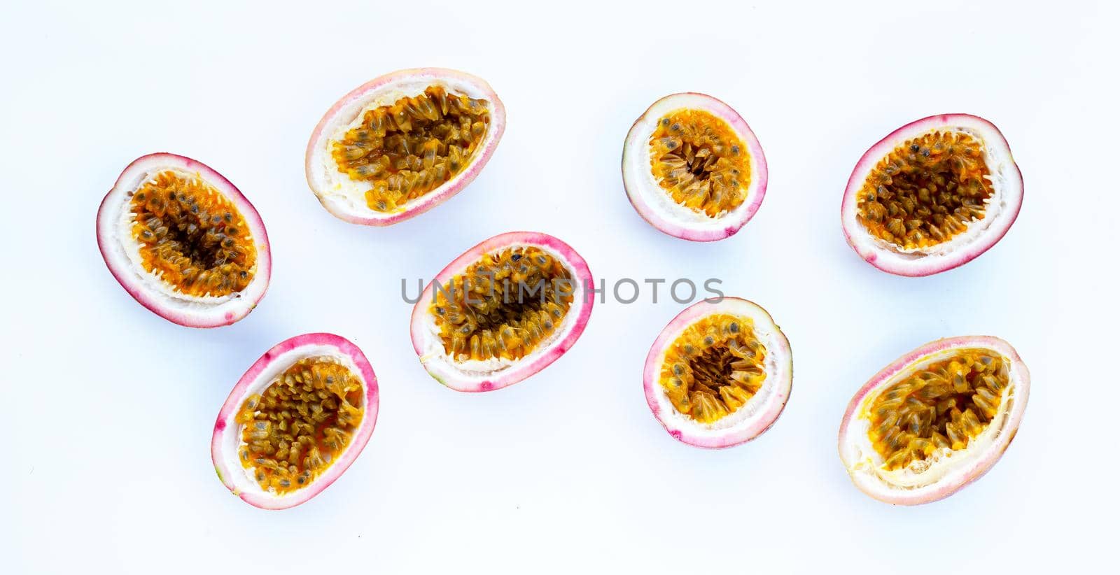 Passion fruit on white background. Top view by Bowonpat