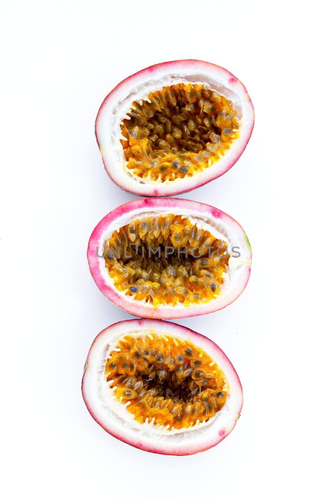 Passion fruit on white background. Top view by Bowonpat