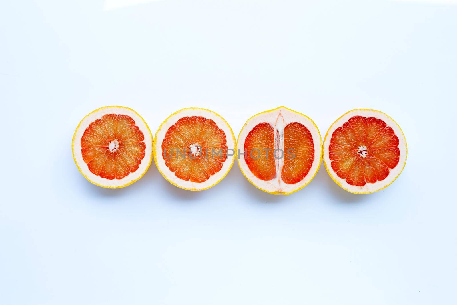 High vitamin C. Juicy grapefruit on white background.