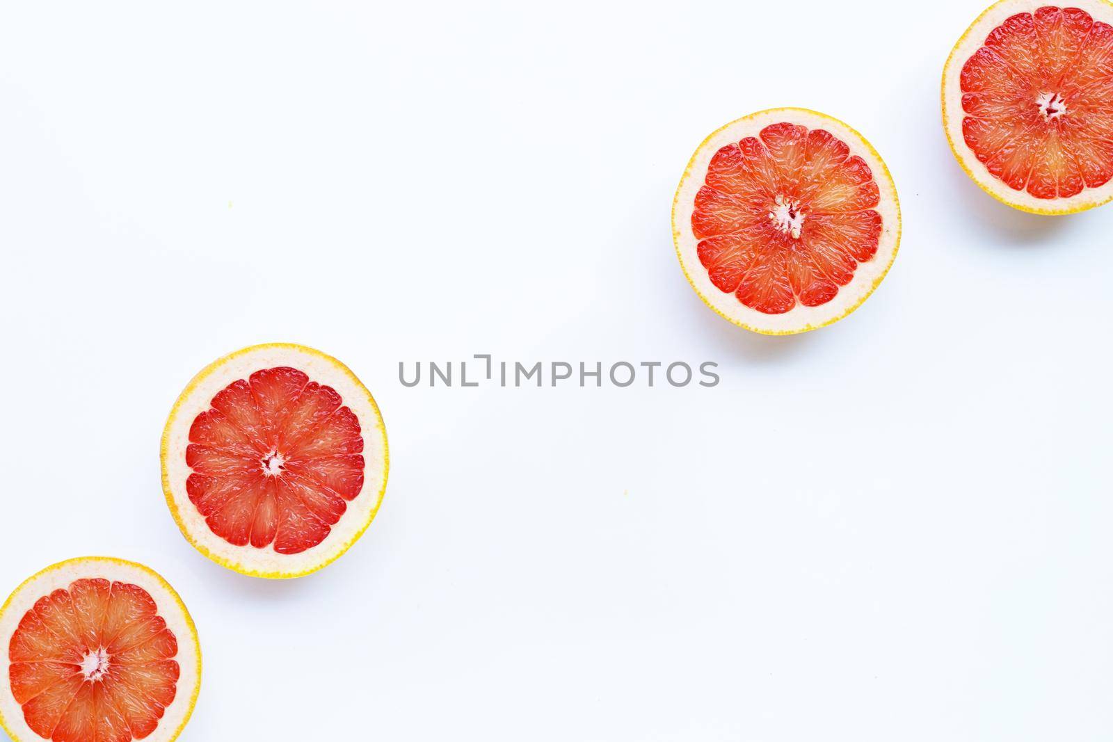 High vitamin C. Juicy grapefruit on white background.