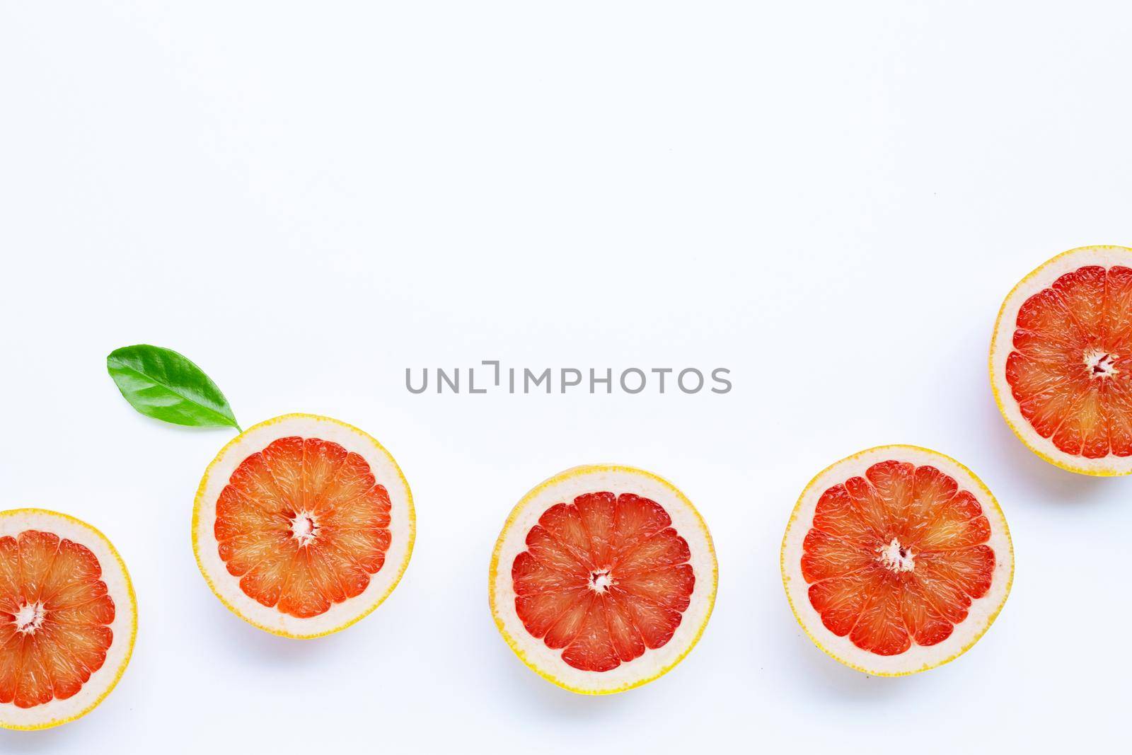 High vitamin C. Juicy grapefruit on white background.